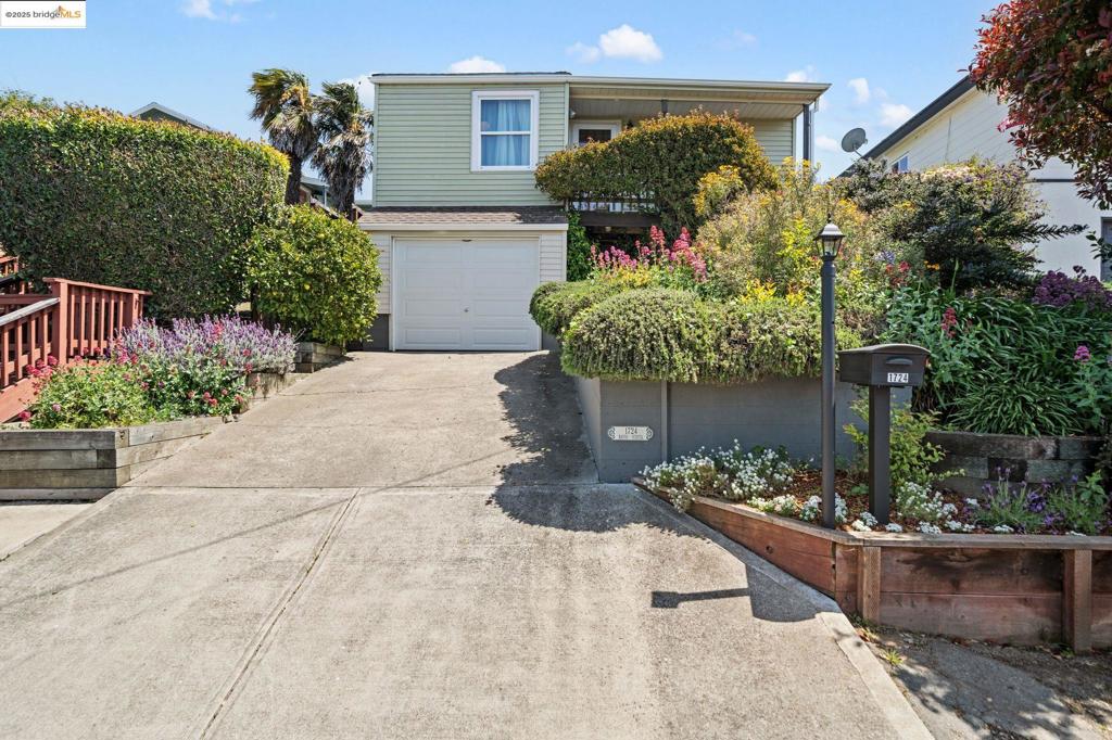 New pricing! Hidden in a serene pocket of the East Bay hills, every inch of this home has been polished and put to great use. The living room flows into the dining area, both benefitting from a front picture window that overlooks the north end of the Bay, hills and shoreline. Little touches convey the heritage of the home, yet this home has been kept with an eye to comfortable modern life, including an efficient kitchen. The bedrooms are amply sized and bright. The primary bedroom, set at the rear of the home, has an updated bathroom adjacent and a cedar-lined closet with built-in cedar shelving. A wood deck and seating terrace at the top of the back garden invite you to linger in the lush garden, with a Meyer lemon tree and many other mature plantings. The electrical system was updated from the main panel to the outlets in the last few years. A partial basement sits below the home, offers functional space for mechanical elements like an extra refrigerator and washer and dryer. Set within blocks of open space and trails but also stores and commute arteries
