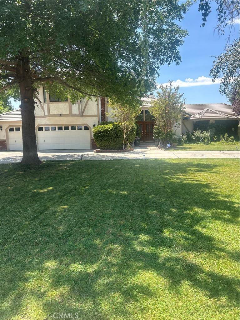 VERY ELEGANT HOME IN ONE OF BEST NEIGHBORHOODS OF THE HIGH DESERT! SPACIOUS BEDROOMS WITH SOLID HARDWOOD FLOORS, UPDATED KITCHEN WITH UPGRADED STAINLESS STEEL WOLF RANGE AND KITCHEN AID DISHWASHER APPLIANCES, SUBZERO BUILT IN REFRIGERATOR, FAMILY ROOM AND LIVING ROOM WITH PORCELAIN TILE FLOORS, LARGE SOLID WOOD WET BAR, HUGE MASTER BEDROOM WITH SITTING AREA, MARBLE FLOOR IN MASTER BEDROOM BATHROOM, BEAUTIFUL FORMAL DINING ROOM, HUGE LAUNDRY ROOM WITH MANY CABINETS, 3 CAR GARAGE WITH 1/2 BATH, SOLID WOOD PLANTATION SHUTTERS THROUGHOUT HOUSE, LARGE COVERED PATIO, BACKYARD HAS AMPLE CEMENT SLAB FOR RV PARKING, OFF ROAD VEHICLES, ETC....HOUSE INCLUDES 2 LARGE SHEDS, BEAUTIFUL GREEN LANDSCAPING FRONT AND BACK, TOO TRULY APPRECIATE THIS UNIQUE HOUSE AND ITS CUSTOM MADE FEATURES ..YOU HAVE TO VIEW IT! ALSO HOUSE IS CONVENIENTLY LOCATED ONLY 5 MINUTES AWAY FROM HOME DEPOT, LOWES, TARGET, STATER BROTHERS, WINCO, "OPENING SOON" SPROUTS, AND MANY MORE STORES AND RESTAURANTS! ALSO GOOD SCHOOLS ARE NEARBY
