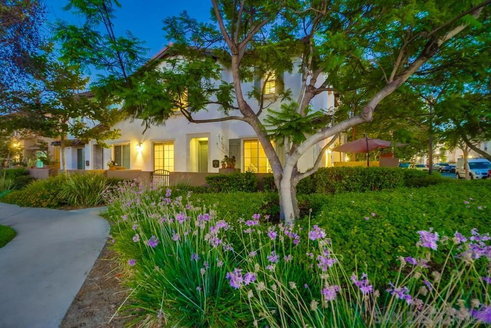 Step into this rare corner-lot gem in the highly sought-after Winding Walk community—where style, space, and location converge. Imagine sipping your morning coffee on your private front and side patios while overlooking green parks, award-winning schools, and premier shopping just minutes away. The heart of the home? A kitchen built for serious cooks and casual hosts—featuring sleek stainless steel appliances, rich cherry wood cabinetry, granite countertops, and a custom backsplash. The oversized island with breakfast bar and walk-in pantry make it ideal for entertaining friends or feeding a crowd. Your family room with cozy fireplace and media niche sets the stage for movie nights or laid-back weekends. Flow seamlessly from kitchen to dining to patio—every space thoughtfully designed to help you connect, gather, and relax. Upstairs? Room to spread your wings. Downstairs? A spacious garage ready for your vehicles, a home gym, or that side hustle gear.