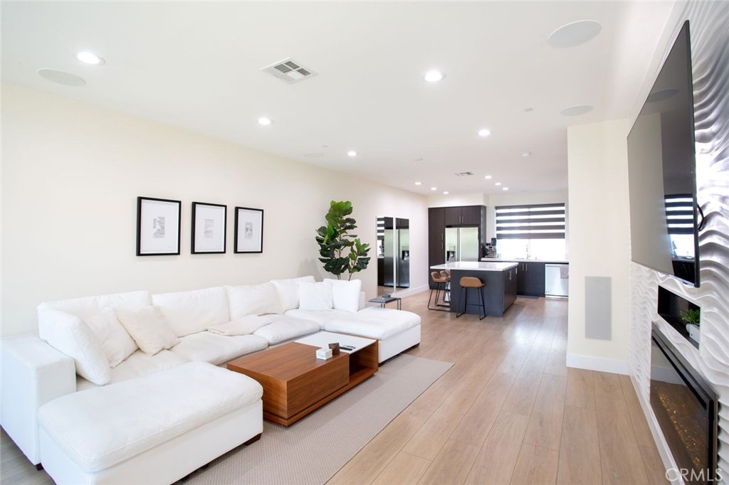 Welcome to one of the only park-facing 3-bedroom townhome with a 3-car garage in all of Central Park West, Irvine!
This modern 3-level home offers unobstructed views of the park, and over $180,000 in high-end upgrades, blending comfort, sophistication, and location. Spanning 2,245 square feet (plus a massive finished garage), this 3-bed, 3-bath townhome is designed for both elegant living and smart investment. The gourmet kitchen features an oversized quartz island, custom soft-close cabinetry, and top-tier GE Profile and Samsung appliances. Enjoy a custom surround-sound system, modern fireplace, EV charging, ADT alarm, and automated shades throughout. The primary suite includes a minibar, an oversized custom walk-in closet, and private access to a sunset-facing balcony with stunning park views. Natural light floods the open-concept living area, ideal for entertaining or simply relaxing in style. The high-ceiling, large 3-car garage offers abundant storage and flexibility—perfect as a gym, game room, or workspace. Residents enjoy resort-style amenities: pools, parks, pickleball and basketball courts, playgrounds, fitness center, and stylish community spaces—all in the heart of the Irvine Financial District, walking distance to restaurants and grocery, and minutes from John Wayne Airport, UCI, South Coast Plaza, Fashion Island, and Newport Beach.
INVESTOR HIGHLIGHTS: Never-claimed accelerated depreciation: qualifies for an estimated $364,000+ in bonus depreciation if bought in 2025 please consult your CPA for TAX strategy and advice, giving savvy investors a massive head start on tax savings. Strong rent demand & appreciation potential in a high-growth area. One of the only 3-bed, 3-car homes in Central Park West—highly desirable for families, professionals, and roommates (essential for maximizing rents). Premium rental income opportunity due to layout, location, and luxury finishes, compared to other units in the area. Whether you're seeking your dream home or a smart income-generating asset, this rare park-view residence offers unmatched value in one of Orange County’s premier urban communities. Schedule your private tour and make an offer today—this one won’t last. Information contained herein does not constitute Tax advice in any shape or form, buyers should consult their own professionals and do their own due diligence and satisfy.
