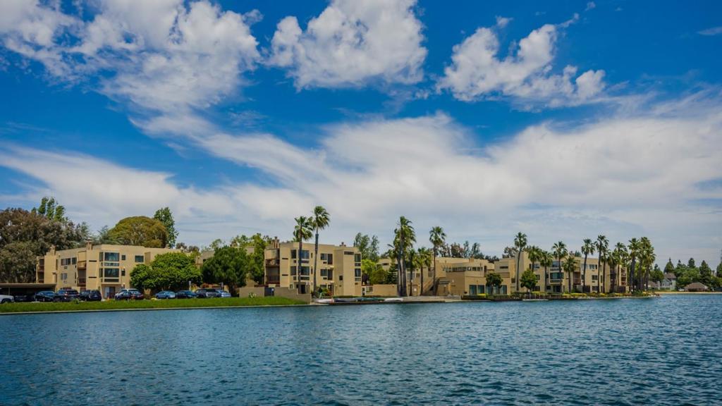 Beautiful Condo with wide water views from almost every room. This Sand Harbour South second floor corner unit features: 2 Bedrooms, 2 updated bathrooms, updated eat-in kitchen with granite countertops, living room with fireplace, dining room with the most amazing wide water views, large master bedroom with walk-in closet, separate pantry, separate laundry room, peaceful deck for outdoor relaxation and enjoyment, storage closet and reserved carport parking. This home enjoys the warmth of ambient light throughout. HOA has had many improvements within the past few years including: exterior and interior paint, common area carpets and new balcony rails. HOA amenities include kayak/paddle board docking area, swimming pool, spa, waterfront clubhouse, beach area, Bay trail and internet service. Conveniently located near parks, schools, tennis courts, sports fields, shopping, restaurants and employment (Visa, Gilead Sciences, Franklin Templeton and much more).