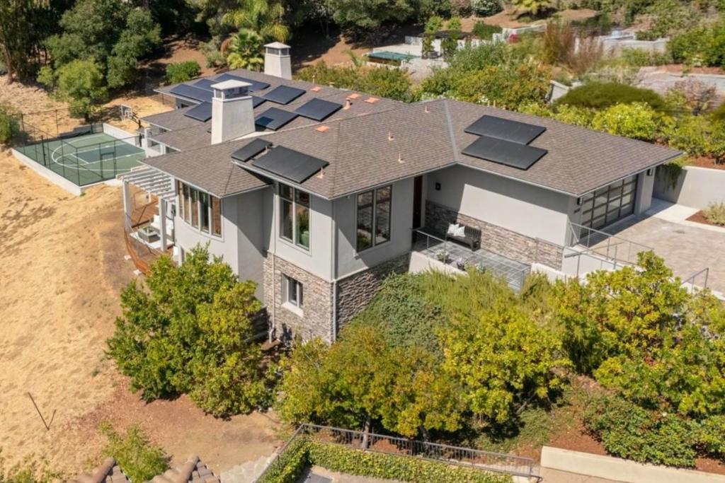 Striking residence built in 2011 offers modern design, volume & natural light. Tucked within an enclave of exclusive homes on a quiet cul-de-sac, this home delivers privacy & tranquility on 0.81+/- acres, yet is only moments from the vibrant heart of downtown Los Altos. Spacious interiors are defined by soaring 12' ceilings, clean architectural lines & sweeping views of the surrounding hills from almost every room in the home. Generous living areas provide the ideal backdrop for entertaining & everyday living, with open flow between the living, dining, kitchen & family room spaces. Tremendous chef's kitchen with expansive center island boasts top-of-the-line appliances. The serene bedroom retreats are oriented to maximize privacy while still capturing picturesque hillside vistas. Spacious 2nd family room offers the perfect setting for casual gatherings, movie nights or a dedicated play space. Multiple sliding glass doors seamlessly connect the interiors to the wrap-around deck & outdoor setting. Sports court provides year round recreation space for pickleball & basketball. Additional amenities include: solar panels, automated window shades, water softener, dual EV outlets & finished 2-car attached garage w/large driveway offering ample guest parking. Acclaimed Los Altos schools.