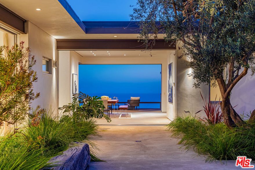 Situated on 1.9 blufftop acres in Encinal Bluffs, this stunning, sustainable estate offers panoramic ocean views and direct beach access. In 2009, W3 Architects stripped the original house to the foundation, reimagining and expanding the state to maximize energy efficiency and far-reaching vistas. The 4-bedroom main residence features light, bright living and dining spaces, a chefs kitchen, floor-to-ceiling pocket doors and an ocean-view blufftop terrace for entertaining. Atop the main house sits a glass-walled loft and 3,000-sq-ft planted living roof. Features include a 1-bed/1-bath guest house, which presides over the solar-heated pool/spa, sports court and parking for 25 cars. A photovoltaic array provides all the home's power needs, while an active solar thermal water heating system provides hot water and in-floor heating. Built with sustainably sourced materials, this Zen-inspired retreat offers absolute privacy minutes from Malibus best shopping and dining.