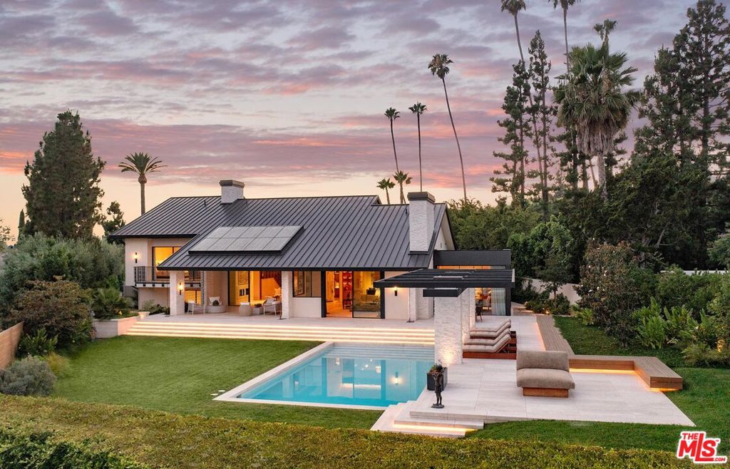 Hal Levitt - Reimagined. Fresh from a multi-year restoration and renovation, this gem is on the most prime section of North Alpine Drive with major views. Set behind gates with large stone motor court, discrete facade belays a dramatic interior with soaring 12ft ceilings and large walls for art. Important public rooms include a large living room with fireplace, library/office, glass enclosed dining room, gourmet kitchen with adjacent family room. Primary suite is a world apart with double baths and vast walk-in closets. 3 secondary bedrooms, all ensuite. Additional features include: service/catering kitchen, 4-car garage, staff parking area with separate gate and state of the art security.