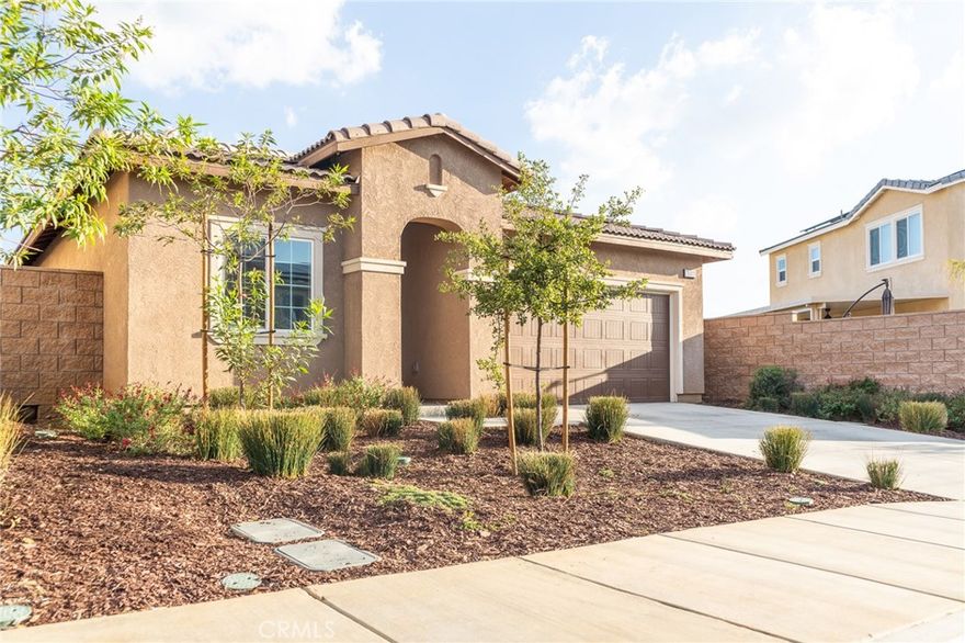 Located in the highly coveted Augusta at The Fairways community, this immaculate single-story home features 3 bedrooms, 2 bathrooms, and a bright, open layout designed for modern living. The spacious living area flows effortlessly into a sleek kitchen highlighted by granite countertops, stainless steel appliances, a large center island, and plenty of cabinet space. The primary suite offers a peaceful retreat with dimmable lighting, a generous walk-in closet, and a private bath with a step-in shower. The additional bedrooms are perfect for family, guests, or a home office, while the interior laundry room adds everyday convenience with built-in storage and attic access. This home is loaded with upgrades, including a tankless water heater, solar through Sunrun, and a fully finished garage. Smart Home features let you control the garage, entry doors, security system, thermostat, lighting, and irrigation directly from your phone. Step outside to a beautifully landscaped backyard featuring an Aluma-wood patio cover, artificial turf, palm trees, decorative rock, and a low-maintenance underground sprinkler system. The ADT security system includes a panel, door camera, sensors, and motion detection for added peace of mind. Residents of The Fairways enjoy access to community pools, parks, walking trails, playgrounds, and a clubhouse—all within minutes of golf courses, schools, and shopping. Stylish, efficient, and move-in ready, this Beaumont home perfectly blends comfort, technology, and resort-style living.