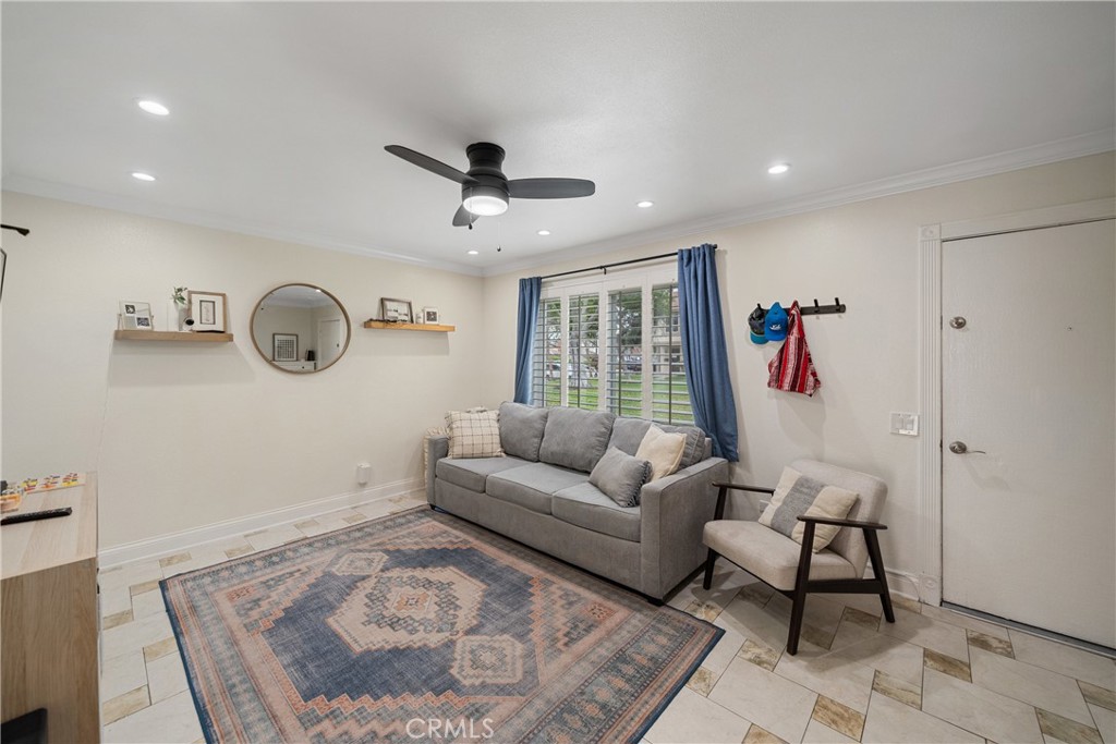 Located in the desirable Bradford Place community, this beautifully updated 3-bedroom, 2.5-bath residence offers the perfect blend of comfort, style, and convenience in the heart of Santa Ana. Just minutes from South Coast Plaza, local parks, and major freeways, the home is ideally situated for a connected and vibrant lifestyle. A rare and highly sought-after floor plan, this property features two full bathroom — providing the convenience and added flexibility for daily living. The home also includes a full-size 2-car garage with plenty of room for both parking and storage. Inside, you’ll find tasteful upgrades throughout, including dual-pane windows, plantation shutters, recessed lighting, and crown molding. The remodeled bathrooms offer a clean, modern aesthetic, while the spacious private patio is perfect for relaxing or entertaining. Out front, the home is surrounded by open greenbelts, adding to the light, airy feel and enhancing curb appeal. Bradford Place offers residents exceptional amenities such as a resort-style pool, clubhouse, sauna, front yard maintenance, security monitoring, and plentiful guest parking. The neighborhood is also walking distance to local dining, shopping, Lillie King Park & Playground, and MacArthur Intermediate School. A rare opportunity to own a thoughtfully upgraded home in one of Santa Ana’s most established communities — this one is not to be missed.