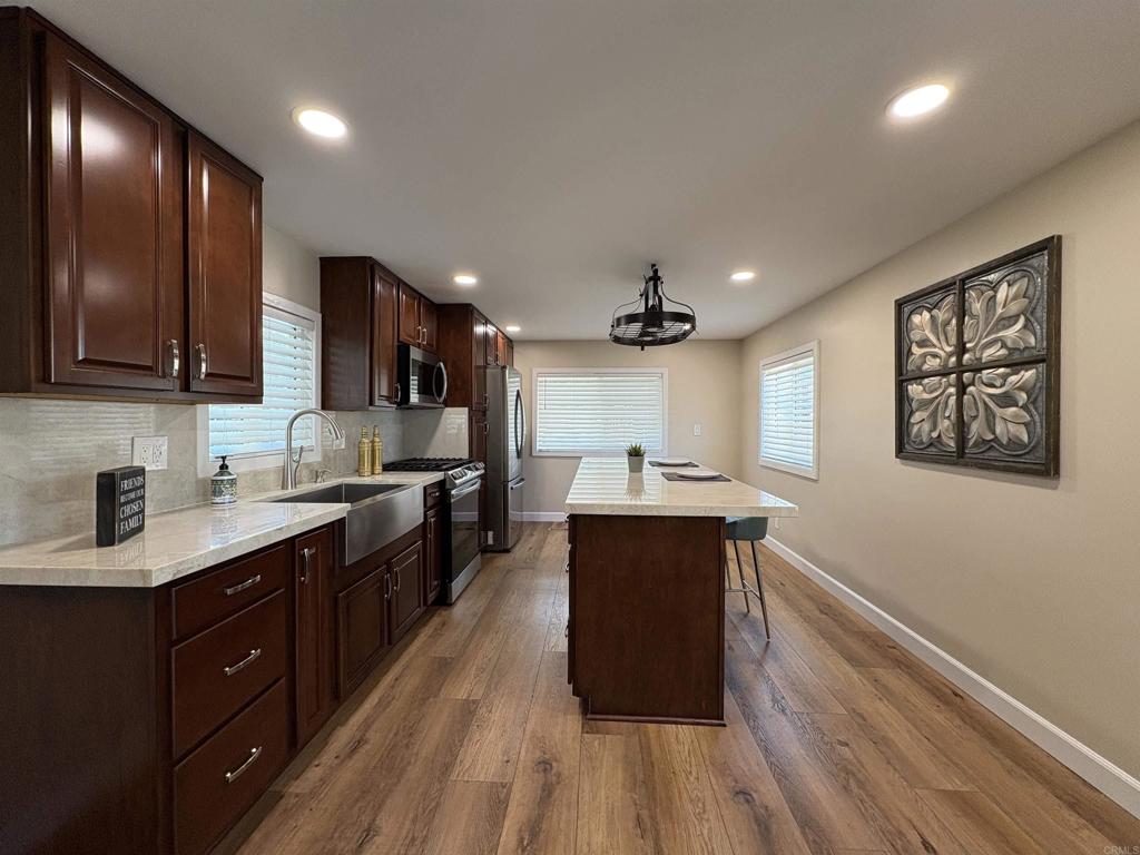 Senior Community Gem! Welcome to this high-end remodel where the homeowner truly spared no expense. This one-bedroom residence has been transformed with a custom-home feel, offering luxury finishes rarely seen in a mobile home. Step inside to discover a bright, open floor plan and a dream kitchen featuring elegant cabinetry, stunning Taj Mahal Quartzite countertops, upgraded stainless-steel appliances, and a spacious eat-at island crowned with a decorative pot rack. The airy living room opens to a side deck — perfect for morning coffee or afternoon tea. The spacious bedroom connects to a spa-like bathroom with a beautiful walk-in shower. Modern upgrades include dual-pane windows, recessed lighting, drywall finishes, and premium vinyl plank flooring. Additional conveniences include a newer washer/dryer, tankless water heater, storage shed, and a covered carport. Outdoors, enjoy a large fenced yard — ideal for pets, gardening, or entertaining — along with a covered patio for year-round enjoyment. Located in Otay Lakes Lodge, a premier senior community in Eastlake/Chula Vista, you’ll be minutes from Otay Ranch Mall, Trader Joe’s, Vons, and dining favorites like Cheesecake Factory and Chick-fil-A. This rare jewel blends luxury living with comfort and convenience. All it needs is you! ** Property Highlights ** Fully remodeled one-bedroom home in Otay Lakes Lodge Senior Community Custom-home feel — elegant cabinetry, Taj Mahal Quartzite countertops, stainless steel appliances Spacious open floor plan with eat-at island and decorative pot rack Bright living room with sliding glass door to side deck for morning coffee or afternoon tea Spa-inspired bathroom with stunning walk-in shower Premium upgrades: dual-pane windows, recessed lighting, drywall, luxury vinyl plank flooring Conveniences: newer washer/dryer, tankless water heater, storage shed, covered carport Outdoor living: large fenced yard (pet-friendly), covered patio, perfect for gardening & entertaining Prime location: minutes from Otay Ranch Mall, Trader Joe’s, Vons, Cheesecake Factory, Chick-fil-A & more ? All this luxury in a senior community setting — a true hidden jewel! S1283.