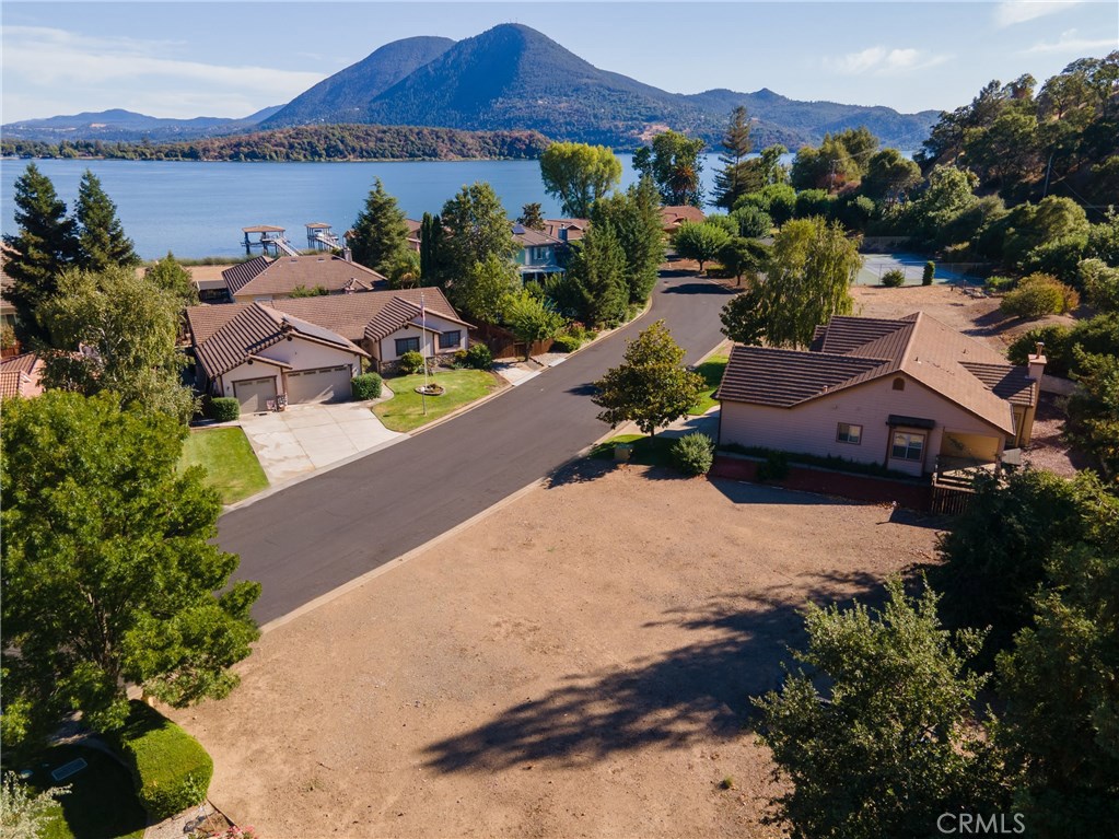 PLAY WHERE YOU LIVE in this perfect hide away called Paradise Valley Estates. Located on the desirable North Shore of the ancient natural lake-Clear Lake. You have a chance to purchase one of the few remaining parcels in this upscale lakeside community. This easy to build approximately ¼ acre level parcel offers underground utilities of water, sewer, power. The parcel is precisely oriented to capture picture perfect views of the lake, surrounding mountains, the majestic Mt. Konocti and restful sunsets. This parcel includes a boat slip in the community’s inlet protected marina. Other amenities include tennis courts, boat launch ramp, lakefront picnic/BBQ park. If this is not enough the location provides short 1 ½ hr. day trips to Mendocino coastline, Sonoma & Napa wine country, coastal redwood forests and the expansive Sacramento valley. Buy today and start designing your perfect hide away home. REMEMBER TO WATCH THE VIRTUAL TOUR OF PARADISE VALLEY ESTATES BY CLICKING ON THE (VT) ICON.