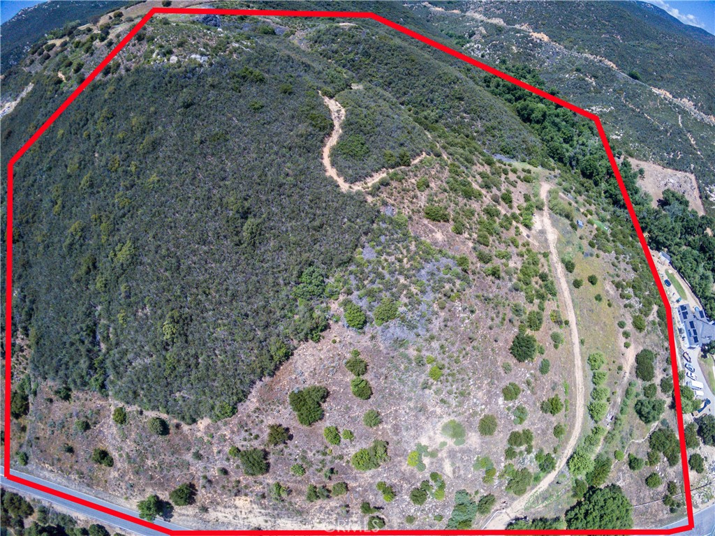 Prime 20-acre Parcel in La Cresta Highlands with Gated Entrance and a Well! Discover the endless possibilities of this expansive 20-acre property nestled in the prestigious La Cresta Highlands. This unique parcel offers an exceptional blend of natural beauty, privacy, and convenient access to urban amenities. Property Highlights: Gated Entrance and Access Road: Enjoy enhanced security and easy access with the gated entrance leading to a well-maintained access road, guiding you to a spacious buildable pad. This pad is ready for you to envision and create your dream home, guest house, or any other structures you desire. Private Hiking Trails: Immerse yourself in nature with private hiking trails that meander through the property, offering stunning views and a tranquil escape right in your backyard. Active Well: The property features an active well, ensuring a reliable and cost-effective water source as you develop and maintain your estate. Convenient Connectivity: Urban Proximity: Despite its serene and secluded environment, this parcel is conveniently located just minutes away from the I-15 freeway. This prime location provides seamless connectivity to nearby urban amenities, including shopping, dining, schools, and more. Lifestyle and Potential: This property is an ideal setting for those looking to create a private retreat, equestrian estate, or luxurious family compound. With ample usable land, natural beauty, and modern conveniences, it’s a perfect canvas for your dreams.
