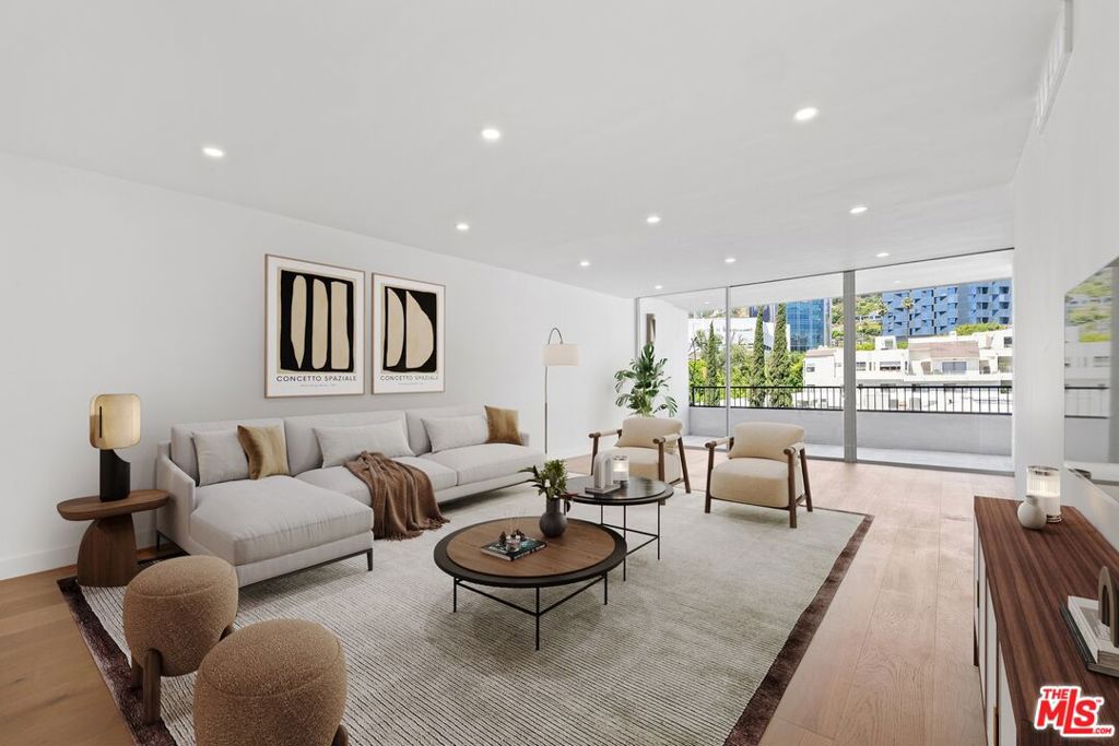 Perched high above the city in one of West Hollywood's most sought-after full-service buildings, #902 is a completely remodeled, light-filled 2 bed 2 bath unit at Empire West that offers effortless sophistication and sweeping views. A spacious open floor plan with in-unit washer/Dryer connects seamlessly to a private balcony. Residents enjoy unrivaled amenities including 24-hour concierge and valet, rooftop pool and lounge with 360 views, state-of-the-art fitness center, tennis court, and a stylish club room. Located just moments from the vibrant energy of the Sunset Strip and the finest dining, shopping, and nightlife West Hollywood has to offer, this is luxury living at its most convenient. Unit has been virtually staged.