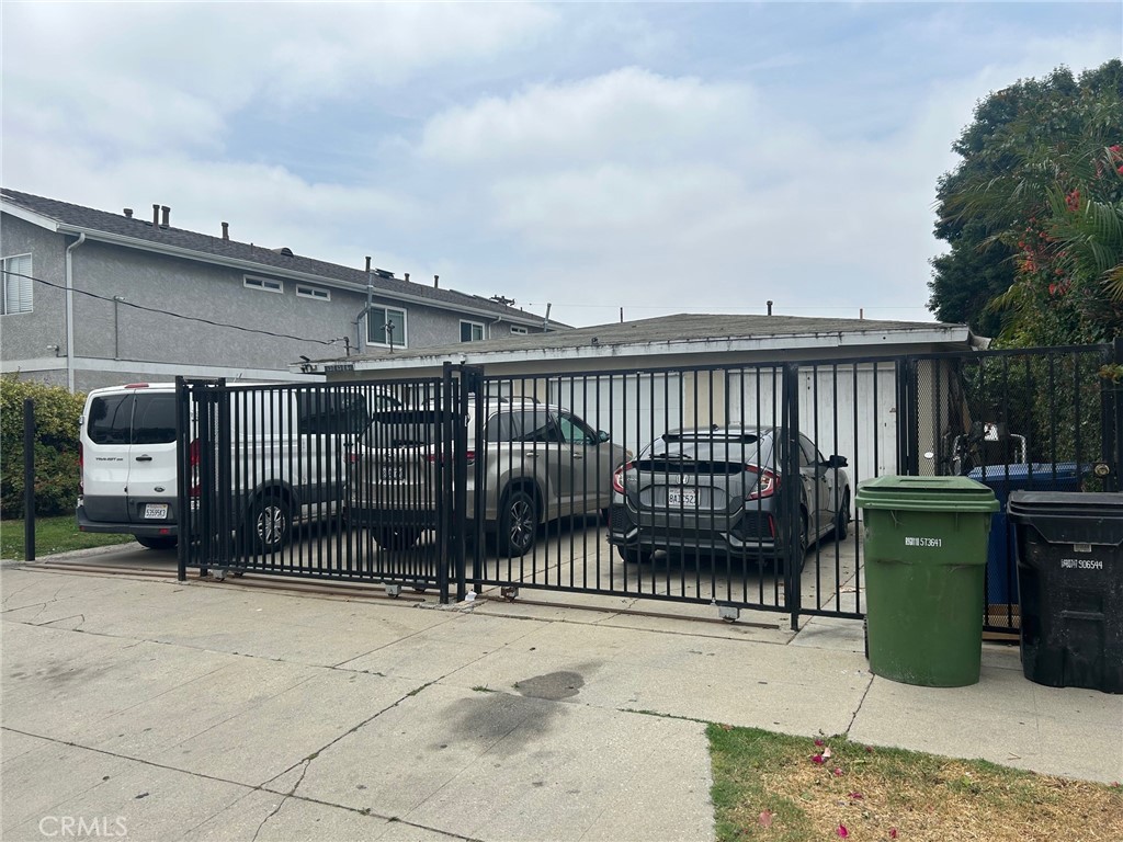 Spacious 3 Units each one with one car garage plus 3 drive way parking spots. All units identical Original hardwood floors and remodel updated bathrooms and kitchens. All units with washer and Dryer hook ups.