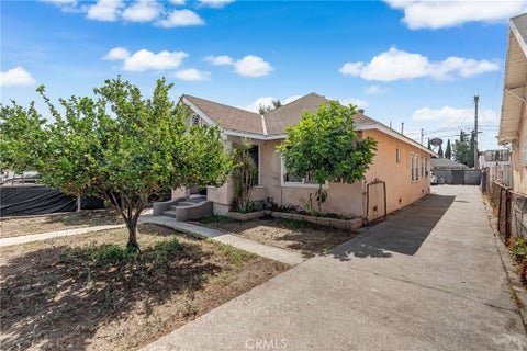 Photo of 1302 E 48th Place, Los Angeles, CA 90011 (MLS # PW26190998)