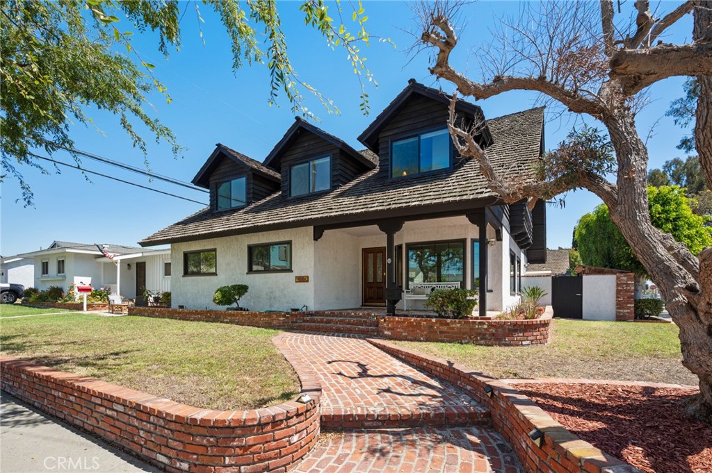 Discover unparalleled space, flexibility, and lifestyle at 1122 Cranbrook Ave. Welcome to a timeless classic in Torrance Gardens—a beautifully appointed 6-bedroom, 3.5-bath home showcasing only the best of SoCal living. Nestled on a generous corner lot nearing 8,000 sq ft, this classic 1951 build blends charm with modern potential.
Step inside to a luminous, open-concept layout where sunlit living and dining areas flow effortlessly. The expansive kitchen, complete with an island and French doors to the backyard, is ready for both everyday meals and festive gatherings.
Upstairs, the luxurious primary wing awaits with a spa-like bath, walk-in shower, and private wet bar. Three additional oversized bedrooms offer flexible space with quaint bay windows that invite cozy moments or serve as productive work nooks.
A dedicated in-law suite—with its own kitchenette, cozy fireplace, and two bedrooms—perfectly accommodates multigenerational living, guests, or income-generating opportunities.
Outside, the large backyard invites your vision—from a pool to lush landscaping— 2 car garage with a loft, great for storage, an ADU, or a personal workshop.
Located in one of Torrance’s most sought-after neighborhoods, you’re just moments from shops, savory dining, exceptional schools, and the beach. A rare offering—endless potential, generous scale, and an enviable location.