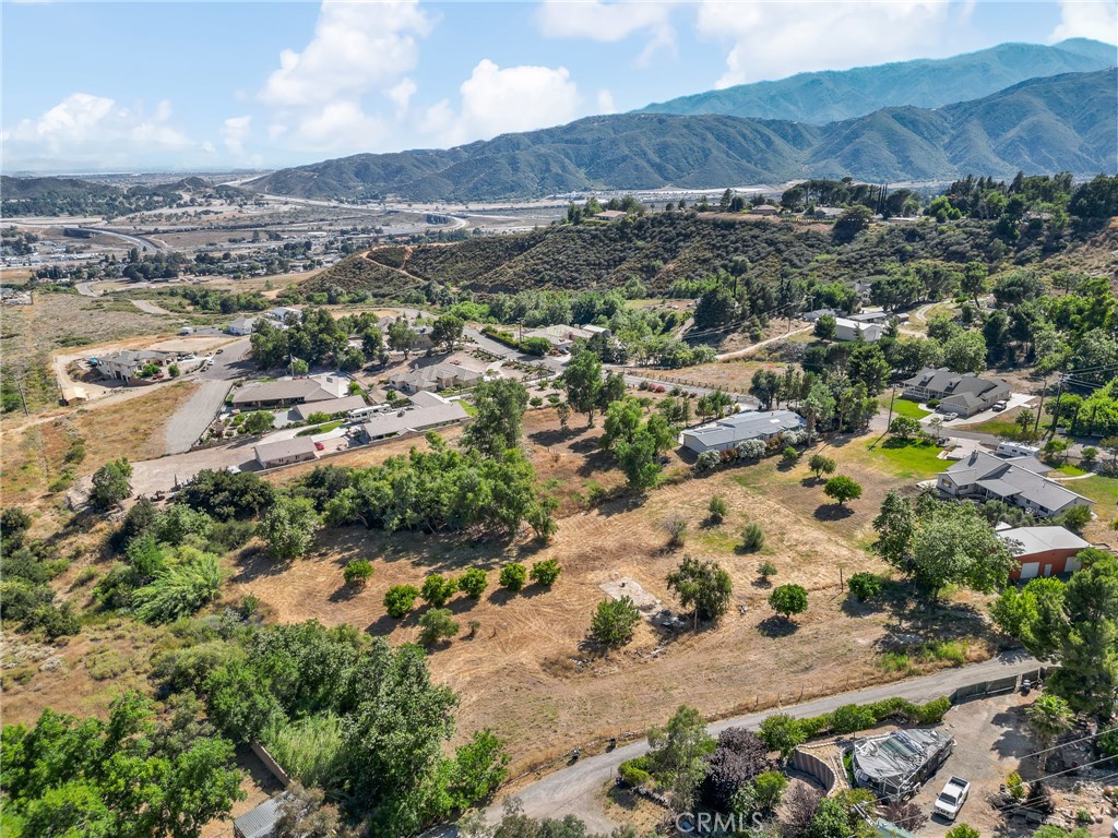 Two scenic parcels in Devore offering a combined 2.54 acres of opportunity, views, and seclusion. APNs 0349-133-39 (approx. 1.25 acres) and 0349-133-40 (approx. 1.29 acres) each include a Devore water share. With two separate APNs, this property presents flexibility for a custom home site—or potentially more. Whether you're dreaming of a private retreat, multigenerational living, or exploring investment potential, this location offers the best of both worlds: privacy and peaceful surroundings, with convenient access to major freeways and shopping. Come enjoy rural living at its finest while staying close to city amenities. Buyer and buyer’s agent to verify all aspects of the property, including zoning, use, boundaries, and utilities.