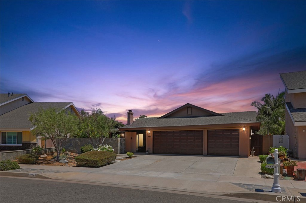 Tucked at the end of a peaceful cul-de-sac with sweeping views of Panorama Heights, this custom single-story Tuscan-inspired retreat offers resort-style living in one of Orange’s most desirable neighborhoods. A charming Dutch door opens to a private, stone walled front courtyard framed by fruit trees and lush, meticulously maintained landscaping—setting the tone for the relaxed elegance found throughout the property. Inside, you’ll find 1,750 square feet of thoughtfully designed living space with an open-concept layout perfect for entertaining or everyday comfort. The chef’s kitchen is the centerpiece of the home, showcasing granite countertops, an oversized prep and serving island, and premium Bosch stainless steel appliances including double ovens, cooktop, and dishwasher. The kitchen flows seamlessly into the spacious family/dining area with vaulted ceilings, recessed lighting, and a custom coffee and wine bar ready for your favorite beverage fridge. A cozy fireplace anchors the living room, which opens to the front courtyard, blending indoor and outdoor living beautifully. The home features four generously sized bedrooms and two bathrooms, including a tranquil primary suite with direct access to the backyard and a private lattice-covered patio ideal for morning coffee or quiet afternoons. New carpet in three bedrooms, engineered hardwood flooring and tile in common areas, built-in speakers throughout interior and exterior spaces, central HVAC, inside laundry, recessed lighting, and upgraded fixtures add both comfort and function. Step outside to your own private oasis: a Pebble Tec pool and spa with dramatic rock features and cascading waterfalls, a built-in BBQ with sit-up bar, a fully covered patio with fan and lighting, and a raised treehouse deck perfect for sunset views or stargazing. Direct gated access to El Modena Park and Basin is ideal for daily nature walks or play. Additional highlights include a 3-car epoxy-coated garage with overhead storage and pull-down ladder, irrigation system with timer, water softener, new custom utility gate, and recent full termite clearance. Located near award-winning McPherson Magnet School (K–8) and El Modena High School, with easy access to the 5, 22, and 55 freeways and a quick drive to the upcoming OC Vibe development near Angel Stadium, this home is a rare combination of style, comfort, location, and lifestyle.