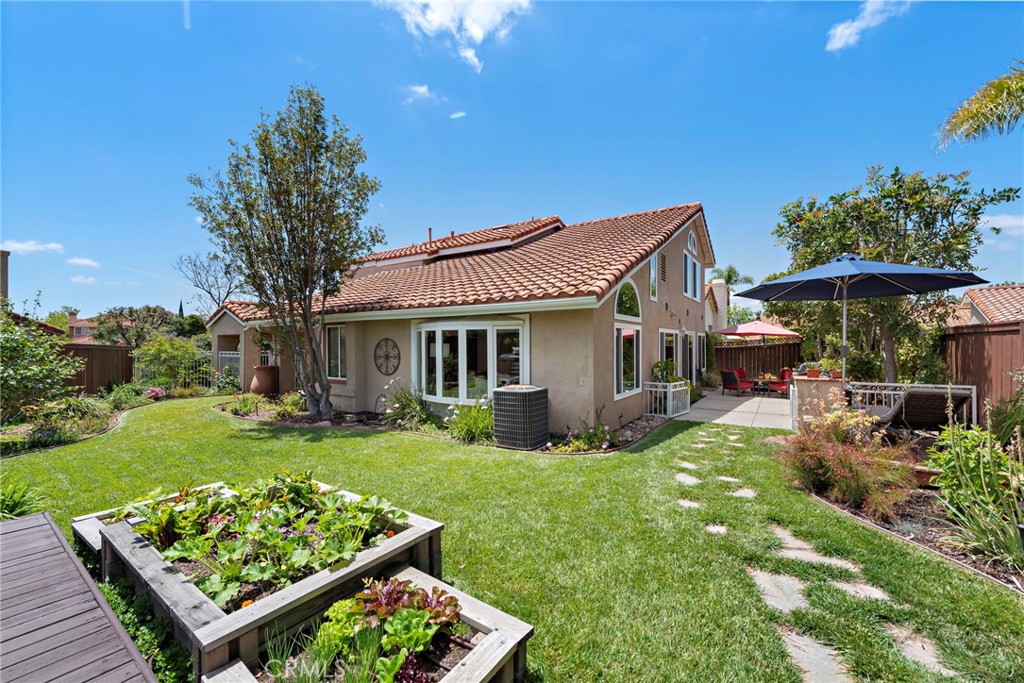 **HUGE LOT**Cul De Sac location adjacent to the Rancho Santa Margarita lake! A newly remodeled master bathroom, pie shaped lot, 3 car garage, and a bedroom down stairs are just a few of the features you'll love! Every bathroom has been upgraded including a custom kitchen with newer stainless steel appliances, white cabinets, and upgraded windows! One of the first communities in Rancho to be developed, the Cantorbrio community is widely heralded as one of the best neighborhoods in Rancho Santa Margarita. Other improvements include a newer roof and freshly painted exterior trim! Main floor bedroom and bathroom too! Access to Rancho Santa Margarita's master-planned community amenities like the beach club, lake, tennis courts, water park, trails, and much more are included with your HOA dues. No Mello Roos! Tax rate is about 1.01%! Shopping, restaurants, parks, and pools just minutes away from your front door. Don't miss this incredible home, make your appointment today! Interest list is forming! Insurance quote at about $2,500 per year available upon request