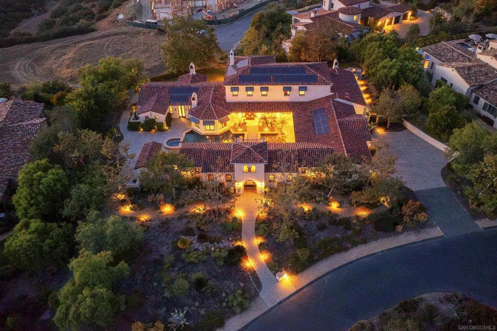 WowCome to an extraordinary 6,909 sq. ft. estate in the prestigious guard-gated community of Santaluz. This stunning residence offers 5 spacious bedrooms, 6.5 baths, and two separate casitas, perfect for guests or multigenerational living. It offers 2 casitas with separate entrances. Designed for both elegance and functionality, the home features: Gourmet chef’s kitchen with a Wolf 6-burner stove and a second butler’s kitchen for seamless entertaining.A private wine cellar, ideal for collectors and entertainers.Primary ensuite retreat with dual vanities, expansive shower, and a spa-like bathroom clad in luxurious onyx tile. The warm honey, caramel, and cream tones with natural veining create a luminous, semi-translucent finish—dramatic and unique, especially when backlit. Resort-style courtyard with pool, perfect for relaxing or hosting unforgettable gatherings. Smart home automation with an advanced Hunter Hydrawise irrigation system (24 stations, preprogrammed). Miele Coffee machine in walk in pantry Two tankless water heaters (including one dedicated to the casitas) and a whole-house water softener. 4-car garage with additional parking. 37 owned solar panels providing energy efficiency. About Santaluz Established in 2002, Santaluz is one of Southern California’s most desirable luxury communities. Within its gates, you’ll find 836 homes, including 308 custom estates ranging from 2,300 sq. ft. to 23,000 sq. ft. The Santaluz Club is renowned for being a vibrant, social, and family-friendly hub for residents of all ages. Highlights include: Championship golf course with tournaments, men’s and ladies’ leagues, and year-round play. Tennis and pickleball with clinics, lessons, and social groups. Camps and year-round activities for kids, making it an ideal community for families. World-class spa with 7 private treatment rooms, relaxation pool, steam, and jacuzzi. Heated lap pool, swim lessons, and daily fitness classes. A rich social calendar featuring Wine Wednesdays, Chophouse Thursdays, live music Fridays, themed dinners, comedy nights, murder mystery dinners, and family-friendly celebrations like summer BBQs with fireworks. Unique experiences such as “Paws & Pinot” (yoga with your dog followed by wine), holiday brunches, literary luncheons, and book clubs. This estate is more than a home — it’s a lifestyle in one of Southern California’s most active and prestigious communities.