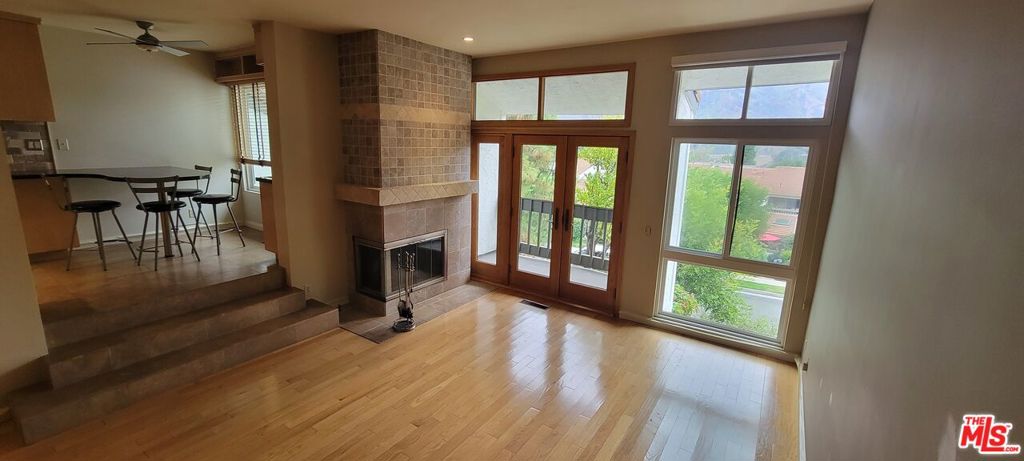 Beautifully updated tri-level townhome in the coveted Palisades Highlands, showcasing stunning mountain views. The first floor features a spacious entry, primary suite with a private outdoor patio, en-suite bathroom, and a large walk-in closet with custom built-ins, along with a second bedroom and full bath. The second floor offers a bright and airy living room with a fireplace and balcony, a gourmet kitchen with breakfast bar and mounted TV, a formal dining room, powder room, and direct access to the attached two-car garage. The third floor includes a bonus room or second primary suite that can also serve as a library or game room, complete with built-in bookshelves and desk, full bath, wet bar, fireplace, 48" flat screen TV, and private balcony. Community amenities include a pool, spa, sauna, gym, and two tennis courts. Available September 1,2025.The documentation for the smoke/environmental remediation is available.