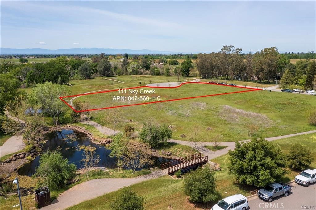 A 1.34 acre lot zoned light industrial located out near the Chico airport is now available for building. This complex is complete with full public services, streets, curbs, and gutters. This beautiful acreage has amenities of walking paths and a creek view. If you have always dreamed about owning your own building or building as an investor these lots have amazing potential.