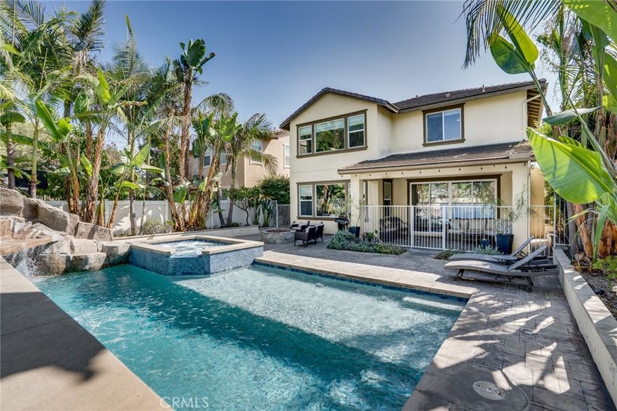 To the Victor, go the spoils......You work hard, why not share that success with family and friends and enjoy this spectacular and immaculate DREAM HOME! With well over 3000 square feet of contemporary comfort with 10' ceilings, 5 expansive bedrooms (2 down & 3 up, two of which are master/primary ensuites). The upstairs primary bedroom is palatial and features a soaking tub, dual & separate vanity areas, an enormous standing shower stall and the largest walk in closet you'll ever see. With 4 contemporary baths, 2 great rooms (1 down and 1 up), a large inside laundry room with folding table, sink and tons of storage you will have room for everyone and everything. Its open floorplan also boasts an impressive chef's gourmet kitchen with massive center island and features elegant dark stained cabinetry, high end stainless appliances, coffee and wine bar areas, beautiful European quartz slab counter tops and a huge walk in pantry and butler's prep area for large gatherings. Speaking of large gathering you will be the home everyone will want to visit (including all of your out of state friends) with your resort style backyard. Over $150k alone was spent on the 1 of a kind pebble tech pool & spa with Baja shelf for sunbathing, a peaceful cascading waterfall over natural looking rock features with a fun built in rock slide for the young and the young at heart. Even with Disneyland less than 10 minutes away with the pretty, colorful landscape lighting and oversized gas firepit you probably will want to skip the fireworks and just "staycation" in your own secluded private backyard. Of course there is a 3 car, direct access garage with insulated doors and dual openers, a high efficiency Central Air/Heating system, a Rheem tankless water heater with turbo condensate water system, a Aquasanan EQ 4000 UV soft water system and a Tesla solar system with low monthly lease. Where do you find a newer home with all of these features in Orange County with NO MELLO ROOS and NO HOA??? Apparently only at 9531 Orange Avenue! This private oasis is extremely high caliber and has more bells and whistles than a Disney parade. Whether it is your entertainer's dream home or a multi generational family home you will not be disappointed.