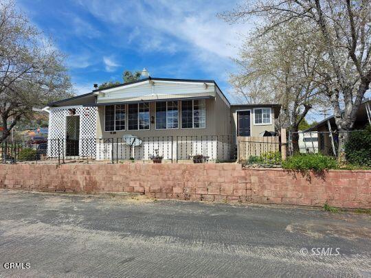 Don't miss this move-in ready double wide mobile home near Lake Isabella! Offering 2 bedrooms, 2 bathrooms, and approximately 1,000 square feet of comfortable living space, this charming home sits on a desirable corner lot with absolutely stunning mountain views. Enjoy year-round comfort with three newer mini splits, ceiling fans, and a newer pellet stove. The home also features a stackable washer and dryer, a covered patio perfect for relaxing or entertaining, and plenty of natural light throughout. A perfect full-time residence or weekend getaway!