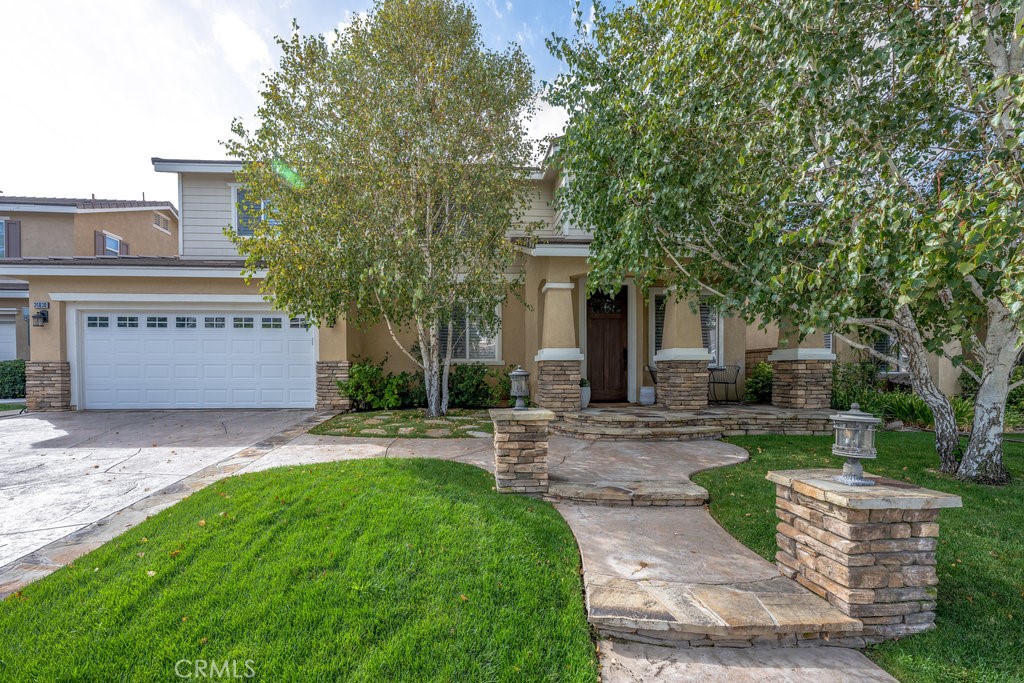 Stunning 5-Bedroom Home in Tesoro Highlands – Valencia
Welcome to this beautifully upgraded 5-bedroom, 3-bathroom home located in the highly sought-after Tesoro Highlands neighborhood of Valencia. This spacious and well-appointed residence features custom built-ins, elegant stone countertops, and high-end appliances throughout.
Enjoy the flexibility of a 3-car tandem garage and an oversized bonus room on the second floor—perfect for a home theater, playroom, or additional living space. The primary suite boasts a private balcony, updated bathroom with soaking tub, offering a peaceful retreat with views.
Step outside to your backyard oasis featuring beautiful city lights views, a built-in BBQ, a custom outdoor fireplace, and a stylish seating area—ideal for entertaining.
Conveniently located near top-rated schools, scenic hiking trails and parks, shopping, the 5 Freeway, Magic Mountain, and the Castaic Lake Recreation Area, this home truly has it all.
Don't miss your chance to own this exceptional home in one of Valencia’s premier communities!
**Professional photos coming soon
