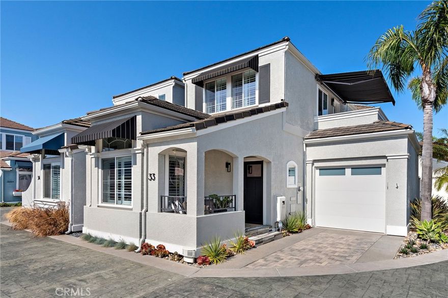 Welcome to Your Dream Coastal Retreat in Newport Beach. This beautifully remodeled 3-bedroom, 2-bath corner unit in the gated Cannery Village Park offers the perfect blend of luxury and functionality, presenting like a model home with its pristine condition and thoughtful design. Bathed in natural light and offering added privacy with no shared walls, this residence is a true sanctuary. Step inside through charming Dutch doors into a bright, open-concept living space adorned with wood flooring, plantation shutters, motorized shades, and modern accents. The convenient first-floor bedroom and adjacent bathroom provide ideal accommodations for guests or single-level living. The gourmet kitchen, equipped with newly installed high-end appliances, is ideal for hosting, while well-planned storage solutions enhance everyday living. Upstairs, two additional bedrooms provide versatile space, one currently used as a stylish home office. Enjoy resort-style amenities just steps away, including a community dock for water activities, a relaxing newly renovated spa, and a BBQ area. World-class dining at Nobu, The Dock, and Bluewater Grill is moments from your doorstep. As one of only 34 homes in this exclusive enclave, this property boasts premium upgrades: a new tankless water heater, AC system, and epoxy garage floors with built-in storage. The home features an attached single car garage and includes an additional reserved parking space for the property. From morning coffee on your sunlit deck to evening sunsets by the water, this is Newport Beach living at its finest. This home is on leased land; inquire for pricing. Furnishings negotiable with purchase.