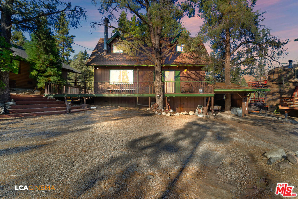 Escape to your own private mountain retreat . This charming 3 bedroom 2 bathroom home nestled in the woods offers the ultimate seclusion and tranquility. Picture cozy evenings by the crackling fireplace, surrounded by rustic charm and the peaceful sounds of nature. The inviting interior features lots of natural light, wood beam ceilings and fresh mountain air. The primary suite has a deck perfect for unwinding and soaking in the serene surroundings . Perfect for weekend escapes or year round living. The expansive wrap around deck, crafted with an eye toward both relaxation and entertainment, invites you to soak in breathtaking panoramic views of the surrounding natural beauty. Whether you are enjoying your morning coffee while watching the sun rise or unwinding with a glass of wine while the sun sets with a glass of wine, the deck provides a front row seat to natures magnificent display. PMC HOA golfing, swimming & tennis