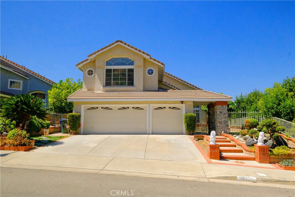 Stunning Two-Story Home with Breathtaking Views in Rowland Heights Located in the highly desirable Rowland Heights neighborhood, this spacious 5-bedroom, 4-bathroom home offers 2,692 sf of living space plus 200 more sf enclosed patio with permit, perfect for growing families or those who love to entertain. The inviting entryway leads to a bright and open floor plan, with a large formal living room and dining area, ideal for gatherings. The well-appointed kitchen with new countertop opens into a cozy family room with a fireplace—perfect for relaxing and enjoying family time. Downstairs bedroom with full bath. Upstairs, the generously sized master suite offers a peaceful retreat with a large walk-in closet, dual vanities, and a private en-suite bathroom. two additional bedrooms provide plenty of space for family or guests. Enjoy California living at its best with stunning views from the backyard, ideal for outdoor entertaining with newly build Gazebo, gardening, or simply relaxing. The home also includes a 3-car garage, providing ample space for parking and storage. Conveniently located near shopping, dining, schools, and major freeways, this home offers both privacy and easy access to everything you need. Don’t miss out on this exceptional opportunity to own a beautiful home in one of Rowland Heights' most sought-after neighborhoods.