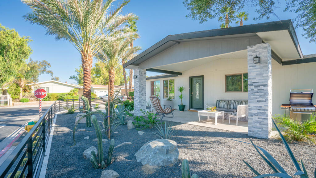 This impressive 2 bedrooms and 2 full baths home with a detached 1 guest bedroom have been completely remodeled and is move in ready! Features include Open concept living with tall ceilings blends seamlessly, large living room windows that let in tons of natural light, ample space for your largest living room set. There is Laminate Flooring throughout the home. The kitchen offers newer Stainless-Steel appliances, a center island, ample cabinet space, a walk-in pantry and a formal dining area. There is also a Wet-Bar. The large master suite has room for a sitting area or a desk, both bedroom closets have built-in cabinets. Master bathroom features dual sinks and a large, enclosed shower. The exterior and interior have been painted; the roof was replaced approximately 5 months ago. New Water Heater. The private patio offers privacy and tranquil atmosphere. The entire yard has been professionally landscaped. New wrought iron rail through the front of the yard provides privacy for those homeowners that have pets. A finished garage with a brand-new garage door.This is truly a homeowner's pride and joy remodeled, in the front porch you see all the stacking stonework done and an amazing landscape design that brings joy!!!! In addition, this home sits across from one of the community pools. This home is in Ivey Ranch CC & GC, a gated, senior community of manufactured homes integrated with a 9 hole, SCGA rated, Semi-private golf course, Pro-shop, Driving range, Club house and The Wrap, a seasonal restaurant. In Ivey Ranch you own the land. This home has a 413 Permanent Foundation and is ready for financing.