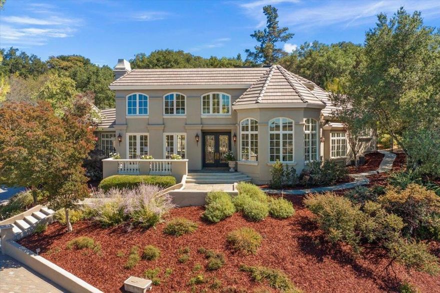 Situated at the end of a private cul-de-sac, this gated Saratoga estate offers sweeping views of the Bay and surrounding vineyard valleys. Designed for both privacy and entertaining, the property features a gated entry, discreet fencing, and a driveway with parking for 10+ cars. Inside, more than 7,500 sq ft of living space spans three levels, showcasing custom millwork, artisan glass, and expansive terraces. Highlights highlights include multiple guest suites, home office, music room, theatre, gym, and game rooms. The resort-style grounds include a pool, spa, and multiple terraces with space for gardens, a cabana, or vineyard. Just about five minutes to grocery stores, shopping, and amenities, and about ten minutes to Highway 85, this property combines seclusion with convenience. A rare opportunity to own a private Saratoga retreat at the summit of Silicon Valley.
