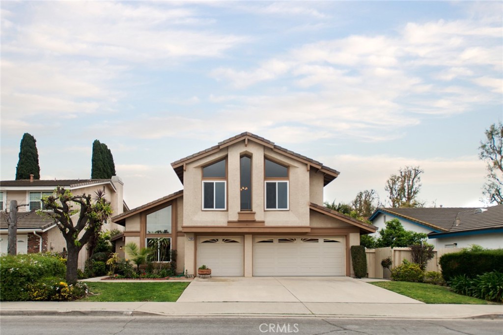 Welcome to 13 Seville, a 4 bedroom, 2.5 bath home with a spacious bonus room in Irvine’s desirable Northwood Crestwood Estates. Featuring new flooring, modern fixtures, remodeled bathrooms, and a sleek kitchen, this home offers bright, open living with vaulted ceilings and a dramatic entry. A main-level bedroom doubles as a home office or guest room, while upstairs you'll find three additional bedrooms and a flexible bonus room with a bar. The primary suite impresses with vaulted ceilings, dual closets, and a double vanity. Enjoy a private backyard ideal for entertaining, along with a rare 3-car garage. Conveniently located near Hicks Canyon Trail, parks, shopping, top-rated schools, and major freeways.
