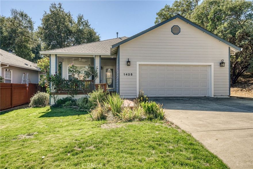 Welcome to this spacious and well-maintained home located in a cul-de-sac. Built in 2003, this 1,864 sq. ft. home offers 3 bedrooms and 2 bathrooms, providing plenty of room for comfortable living. Situated on nearly a 1/4-acre lot, this property features a large backyard with a spacious patio, perfect for outdoor gatherings, and a front porch where you can enjoy peaceful evenings. Inside, you'll find a welcoming family room with a cozy propane stove and vaulted ceilings that create a bright, airy atmosphere. The open kitchen is complete with tile countertops, with ample space for cooking and entertaining. The large primary suite is a true retreat, featuring a beautiful walk-in tile shower, walk-in closet, and an abundance of space. Attached garage with extra space for RV or boat parking. Easy access to nearby schools, restaurants, shopping, parks, and the lake. With its fantastic location and exceptional features, this home is perfect for anyone looking to enjoy a desirable neighborhood while being close to all the conveniences you need.