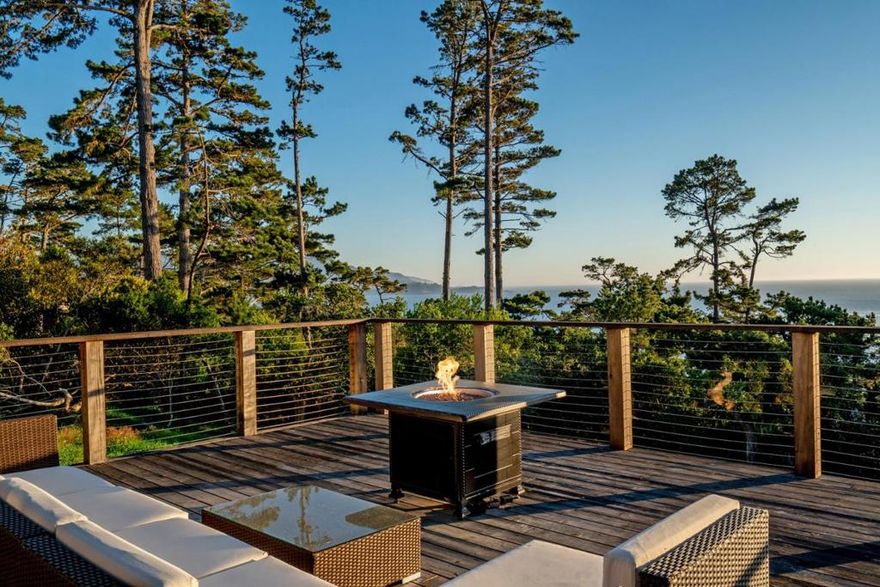 Located on the ocean side of Padre Lane near The Lodge and Pebble Beach Golf Course, this single-level Post-Adobe home sits on one of the finest view lots in Pebble Beach. An expansive southwest-facing deck showcases sweeping views of Point Lobos and the Pacific coastline extending to Big Sur. Upon entering, you are welcomed into a comfortable living room with vaulted ceilings and hardwood floors. The space opens to the dining area and kitchen, with sliding glass doors that lead to outdoor living areas. The spacious, sun-splashed, ocean-view lot is the star of the show, offering exceptional potential. The home features three bedrooms, four bathrooms, and 2,750 square feet of light-filled living space designed to enjoy the idyllic Monterey Peninsula climate.