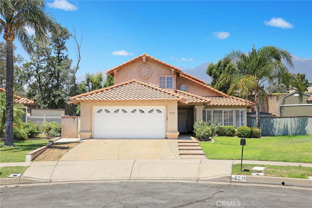 Discover comfort and style in this beautifully upgraded 4-bedroom, 3-bath home tucked away on a quiet cul-de-sac at 6516 Alameda Ave in Rancho Cucamonga. With 1,895 sq ft of light-filled living space, this home features soaring cathedral ceilings and a smart, open layout. The spacious family room with a cozy fireplace connects seamlessly to the remodeled kitchen, complete with stainless steel appliances, recessed lighting, and elegant designer touches. Enjoy a formal dining area and a generous living room perfect for hosting guests. The large primary suite offers a walk-in closet, dual vanities, a soaking tub, and a separate shower. With one bedroom and full bath downstairs, it’s ideal for guests or multigenerational living. Additional highlights include plantation shutters, no HOA, copper plumbing, central A/C, a 2-car attached garage, and scenic mountain views. Located near award-winning schools (Banyan Elementary, Vineyard Jr. High, Los Osos High), Central Park, Pacific Electric Trail, Trader Joe’s, Victoria Gardens, and the 210 freeway. This is the home you’ve been waiting for—don’t miss it!