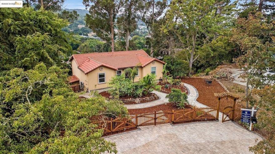 Approximately 2,400 square feet of living space on a huge and private 0.35-acre lot. This charming house features an inviting entryway, lush landscaping, and scenic views. The open floor plan offers abundant natural light and vaulted ceilings, creating a spacious and airy atmosphere. The hardwood floors throughout add warmth and elegance.  The primary bedroom is spacious with an elegant vanity and tiled shower in the in-suite bathroom. Three additional bedrooms, one on the upper level and three on the lower level, provide ample room. The kitchen is large and open, with a huge layout that takes advantage of the 180-degree views both up and down. The property also boasts a spacious deck and a scenic backyard with lush natural greenery.  Other notable features include a paved walkway, four off street private parking and a beautiful artistically designed fencing. A charming exterior, and a wrap-around double deck. The home has been meticulously updated with custom tilework, a tile roof, and a split-zone heating and air conditioning system. This home only comes once in a life time! Worth a visit.           Direct 3D tour viewing: https://my.matterport.com/show/m=3p5XMEh33j6