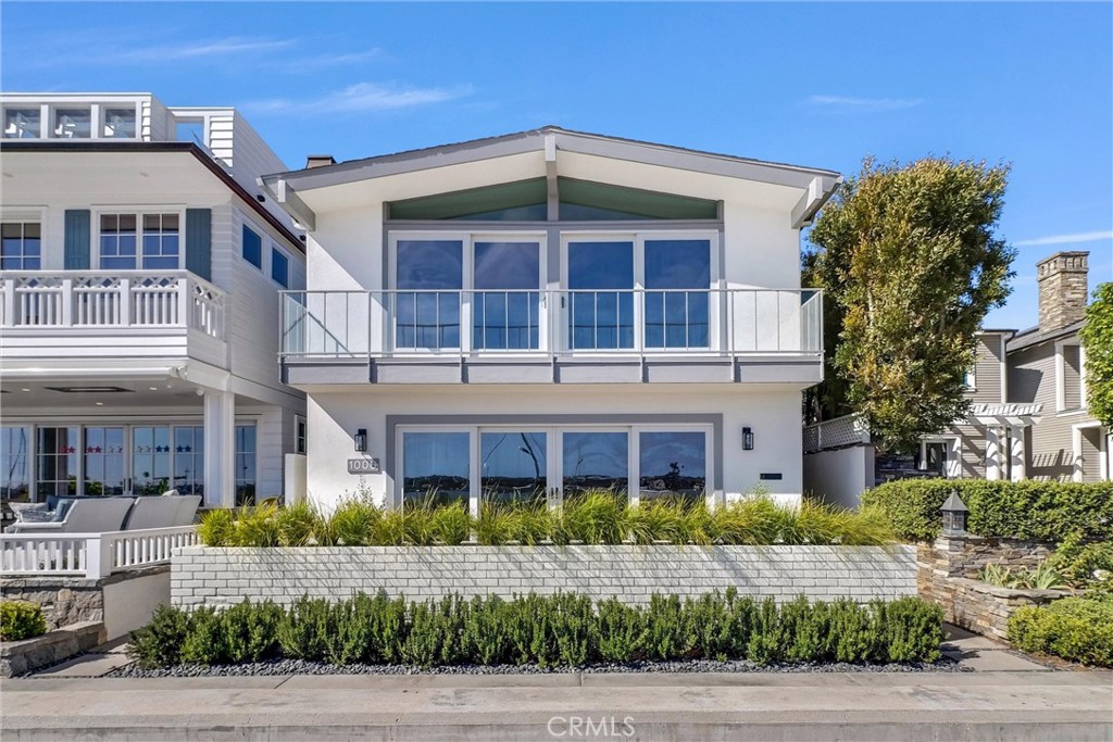 This stunning 3,000 square foot bay front estate holds court at one of the best locations on Balboa Island, with the beach mere feet from its front patio and unobstructed views of multi-million-dollar yachts floating by. Set in close proximity to the Balboa Island Ferry and within an easy stroll of charming Marine Avenue's unique boutiques and eateries, enjoy the lifestyle of an exclusive beachside resort with the ambiance of a European village. Living spaces are large and light-filled, including a spacious kitchen, 4 big bedrooms and 5 updated bathrooms. Take advantage of the kitchen's top-line appliances and ample counter space to cook and host parties in the open dining room, which includes ample built-in cabinetry. Luxuriate beside the living room fireplace on cool nights, or ascend the floating stairway to settle beside a second living room with a fireplace and enjoy a nightcap from the wet bar. The garage easily holds two cars along with the bonus of a third parking spot behind.