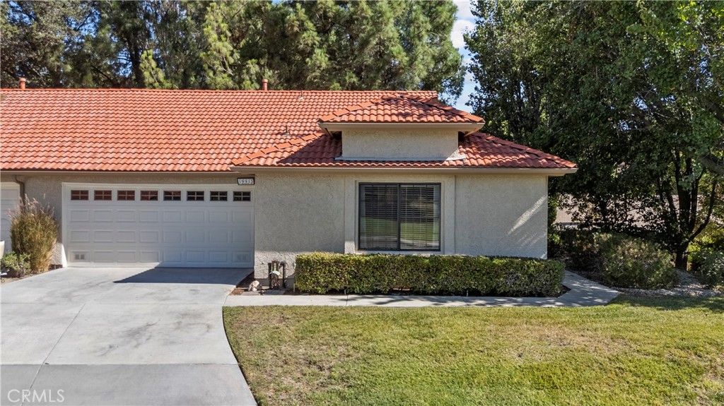Beautifully Updated Single-Level End Unit in Scenic Hills. Welcome to this highly desirable single-story end unit tucked behind the gates of the peaceful Scenic Hills community. This rare 2-bedroom, 2-bathroom layout offers stunning views of the golf course right across the street. Step inside to find a spacious kitchen with a charming garden window, a dedicated dining room, and a living room with vaulted ceilings, all thoughtfully separated from the bedrooms for privacy. The primary suite features an updated walk-in shower and a generous walk-in closet. The secondary bedroom makes a perfect guest room, home office, or creative space. Upgrades include laminate flooring throughout, wood blinds, new ceiling fans, a water heater (replaced in 2018), and LED recessed lighting in the kitchen and living room for a bright, welcoming feel. A water line was added for the refrigerator, making this kitchen even more functional. Relax on your private back patio with no rear neighbors, the perfect spot to enjoy your morning coffee or unwind in the evening. This home also offers a two-car garage with custom built-in storage for added convenience. Scenic Hills is a gated, NO age-restriction community with NO MELLO-ROOS and an impressive array of resort-style amenities, including: Private Golf Course, Sparkling Pool & Sauna, Fully Equipped Gym, Tennis & Basketball Courts, BBQ & Picnic Area, Library, Conference & Reading Rooms, Billiards Room, Onsite Management & Community Security Patrol. HOA dues include grounds maintenance, trash service, and earthquake insurance. Conveniently located near the 14 Freeway, Costco, Sam’s Club, Target, dining, supermarkets, and medical facilities. This Scenic Hills gem offers comfort, privacy, and a vibrant community lifestyle — schedule your showing today!
