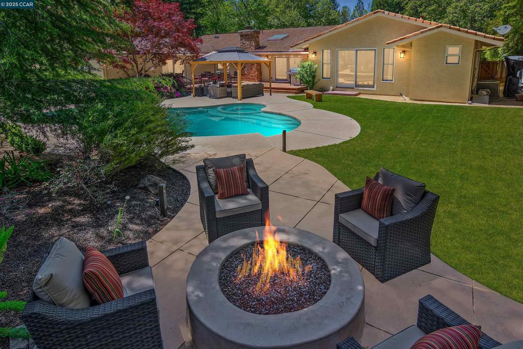AMAZING REFRESH NEW EXTERIOR/INTERIOR PAINT.STUNNING STAGING. Discover treasure in Danville’s gated Hidden Oaks. Sensational move-in ready single-level. Meticulously maintained, brilliantly updated. Bkyd paradise. Pool, spa, gas fire pit, deck, patio, pergola, spts ct. Bordering redwds, rose garden, lush foliage, lawn. Rm for ADU, income-producing rental. 3643+/-SF. 5 bds. 3.5 bths. .43 acres. Fresh int/ext paint. Hardwd & carpet flrs. Skylights. Crown molding. Recessed LED lights. Dual-pane Andersen drs & wndws. Formal lvg rm w/vaulted ceiling, frpl, Formal dining room. Chef’s kitchen w/leathered quartzite counters, travertine tile bksplsh, custom cabinets. Dual ovens, five-burner cooktop, refrigerator, microwave. DW. Casual dining area. Fam rm w/frpl. Bonus rm w/custom built-ins, rm for pool table, home theater. Slider to bkyd. Primary suite w/gas frpl, sitting rm, vaulted ceiling, slider to bkyd. Updated en suite w/2 vanities, walk-in closet, stall shwr, new fixtures. Add’l bdrms w/carpet, California Closets built-ins. 5th bdrm/office w/2 built-in wrkstations. 3-car garage. 3 EV chargers. Storage. Updated dual-zoned HVAC, wtr htr & pool equipmt. Laundry rm, flr-to-ceiling cabinets, sink. Near Blckhwk Plaza, downtown, walking trails, Mt. Diablo, fways, top-rated SRVUSD schls.