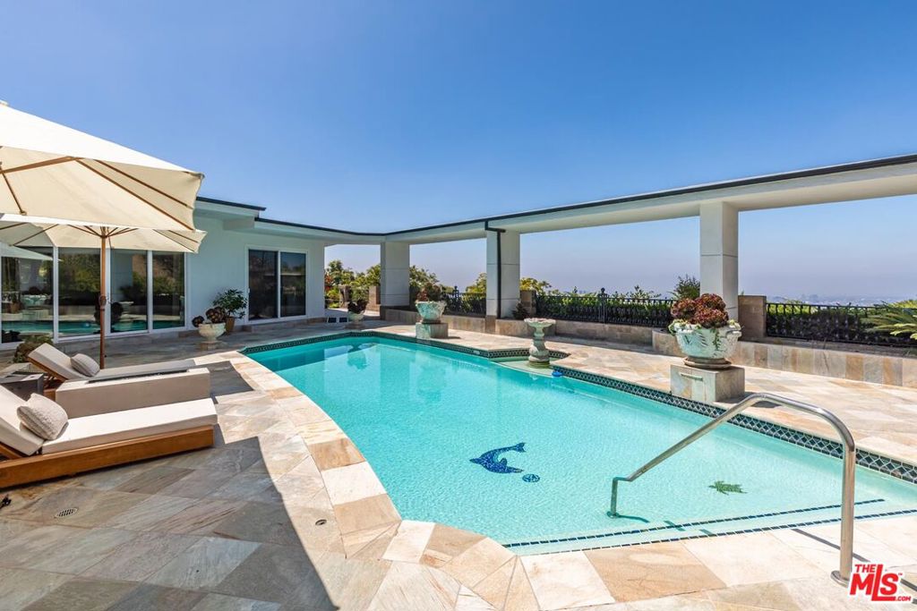 Experience the pinnacle of luxury living on Chalette Drive, renowned as "Billionaire's Road" in Trousdale Estates, one of Beverly Hills' most exclusive addresses. This fully remodeled designer estate seamlessly blends modern sophistication with timeless elegance, offering breathtaking skyline and city views from nearly every room. Behind its private gates, this stunning residence boasts five spacious bedroom suites and fiveandahalf spalike bathrooms, each designed with comfort and style in mind and appointed with brandnew highend furnishings. Every suite features its own ensuite bath, creating the perfect balance of privacy and indulgence.The chef's kitchen is a masterpiece, equipped with professional grade appliances, custom cabinetry, and an open layout that flows effortlessly into expansive living and dining areas ideal for both entertaining and everyday living. Floor to ceiling windows invite natural light while framing the dazzling cityscape below, creating an unmatched indoor-outdoor living experience. Designed for the discerning resident, this estate offers flexible lease terms and is delivered fully furnished to the highest standard. Whether for a mid-term stay or a longterm lease, the residence adapts to your lifestyle needs. Please call for availability and pricing. Please note we accept cryptocurrency as a form of payment.