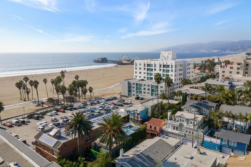 Hidden Gem in Santa Monica! Appreciate one of a kind views of the world famous Santa Monica Pier, beach and ocean from the rooftop deck of this spectacular glass and steel work of art. Just steps to the sand and across the street to the well known Shutters Hotel, this property was Designed by the world renowned architectural firm Lee+Mundwiler. The home flows seamlessly from the entry through the living room to the spacious eat in kitchen. The living spaces are encased in walls of glass and steel, soaking the home in natural light. Centered around a three story atrium with a large adjustable skylight allowing for natural light and air to spill into the home from above.  The master suite boasts a large walk-in closet, an oversized balcony, en-suite bathroom separated by a floor to ceiling wall of glass, a floating vanity, walk-in rain shower and a deep soaking tub. The two additional bedrooms on this floor have en-suite bathrooms and spacious reach in the closet. The bedroom on the lower level is currently set up with sound proofing, ideal for anyone in the music industry. A luxurious full length lap pool anchors the side of the home and a large floating balcony hangs above the pool. The combination of large shrubs, palms, banana trees as well as a secured gate at the front and the back of the property create tranquility, privacy and security for the home. Equipped with Solar Panels on the roof and two Tesla batteries in the garage allow for the possibility of powering the house or charging a backup generator. This home is truly a masterpiece of architecture located just steps away from the sand, exceptional nightlife and much more.