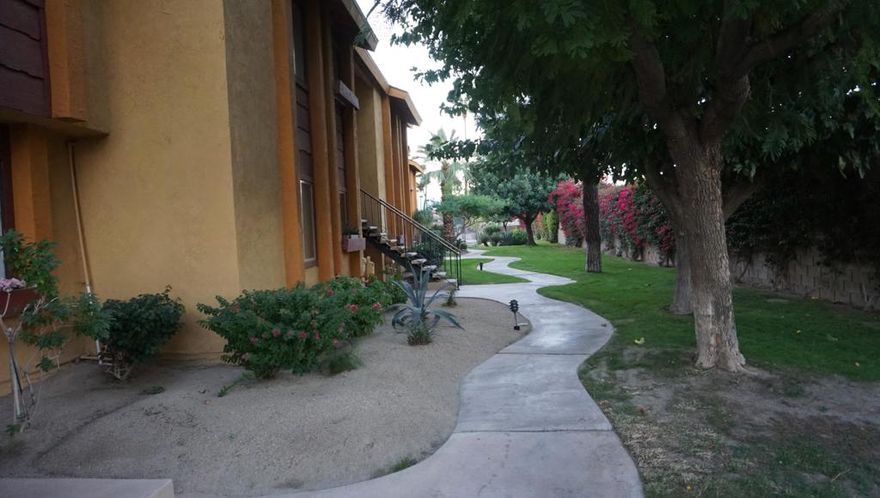 Quail Lakes in Indio offer this beautiful 2-bedroom 2 bath, the primary bedroom offers vaulted ceiling and custom closet built-ins. Unit very well maintained with updated painted cabinets, newer a/c, laminated flooring, newer windows throughout, and sliding doors must see to appreciate. This unit is on the top floor for those amazing views to the lakes from your own private balcony. Community offers pool and spa. Laundry area included also Parking garage