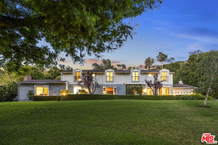 A rare and remarkable chance to claim one of Longridge Estates' most iconic properties, an estate of pedigree, scale, and unlimited potential. Once the cherished home of Hollywood legend Roy Rogers and held by the same family since 1971, this landmark offering spans a full acre of entirely usable, sunlit land on the premier stretch of Longridge Avenue. With 135 feet of sweeping frontage and a private, elevated position set behind gates, the property commands both presence and privacy while showcasing captivating views of the surrounding canyon. The grounds feature rolling lawns, a resort-sized swimmer's pool, and a 1,500 sq. ft. pool cabana, an existing structure with endless versatility, ideal as a secondary entertaining pavilion, guesthouse, or pool house retreat. The main residence exceeds 5,000+ sq. ft. and is defined by its tremendous floor plan and scale, designed for both comfortable living and grand entertaining. Highlights include a massive primary retreat, two junior suites, library/den, office, formal living and dining rooms, a large eat-in kitchen, and generous gathering spaces filled with character and volume. A 1,075 sq. ft. massive four-car garage completes the layout. While gracious and inviting as it stands, the true value lies in the land, location, and limitless potential. This property is a rare blank canvas: whether restored with cosmetic updates, expanded upon its remarkable layout, or reimagined entirely, the result will be a world-class estate in one of the most prestigious enclaves in Los Angeles.Opportunities of this caliber are once-in-a-generation. With its history, canyon views, and rare scale, this is the diamond of Longridge Estates--a singular chance to create a lasting sanctuary of elegance, legacy, and significance.