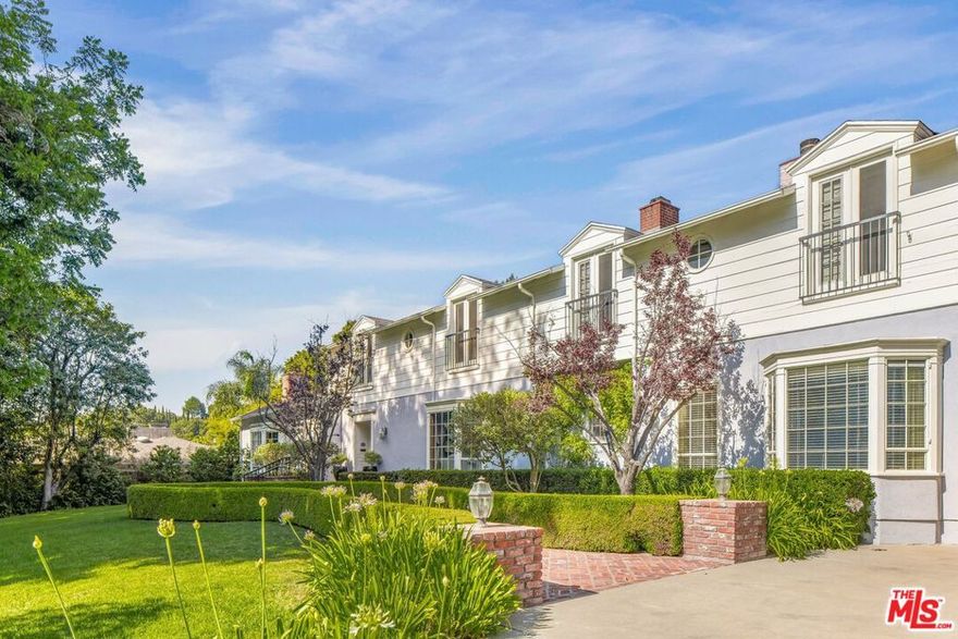 A rare and remarkable chance to claim one of Longridge Estates' most iconic properties, an estate of pedigree, scale, and unlimited potential. Once the cherished home of Hollywood legend Roy Rogers and held by the same family since 1971, this landmark offering spans a full acre of entirely usable, sunlit land on the premier stretch of Longridge Avenue. With 135 feet of sweeping frontage and a private, elevated position set behind gates, the property commands both presence and privacy while showcasing captivating views of the surrounding canyon. The grounds feature rolling lawns, a resort-sized swimmer's pool, and a 1,500 sq. ft. pool cabana, an existing structure with endless versatility, ideal as a secondary entertaining pavilion, guesthouse, or pool house retreat. The main residence exceeds 5,000+ sq. ft. and is defined by its tremendous floor plan and scale, designed for both comfortable living and grand entertaining. Highlights include a massive primary retreat, two junior suites, library/den, office, formal living and dining rooms, a large eat-in kitchen, and generous gathering spaces filled with character and volume. A 1,075 sq. ft. massive four-car garage completes the layout. While gracious and inviting as it stands, the true value lies in the land, location, and limitless potential. This property is a rare blank canvas: whether restored with cosmetic updates, expanded upon its remarkable layout, or reimagined entirely, the result will be a world-class estate in one of the most prestigious enclaves in Los Angeles.Opportunities of this caliber are once-in-a-generation. With its history, canyon views, and rare scale, this is the diamond of Longridge Estates--a singular chance to create a lasting sanctuary of elegance, legacy, and significance.