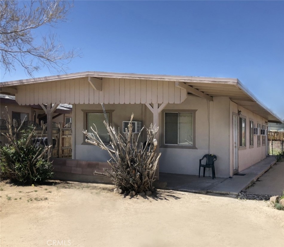 Priced to sell investment opportunity that awaits a savvy investor. Classic duplex with consistent occupancy located in 29 Palms. Great potential for the person that is looking for the right price and conditions on an income producing property. This duplex is a gem that has even more of an upside potential for future rents. Each unit consists of a one bedroom, one bathroom home that boasts great use of space and storage, wall unit AC's and radiant wall heaters. Each one has it's own water meter and gas meter as well as each having their own mailing address. Both units share a water meter. The front unit features beautiful exposed beam ceilings and the back unit has it's own private back yard. Conveniently located next to schools and downtown 29 Palms which is really getting a lot of attention for recent improvements like some new chic restaurants, Freedom Plaza with it's weekly farmers and art market and special events and concerts. The homes are also less than two miles from Luckie Park community park and community pool with baseball, football, skate park, basketball courts, playgrounds and more. They are less than five miles away from the main entrance to Joshua Tree National Park. Less than 6 miles from the 29 Palms Marine base. It is a great jump off point to all that the high desert has to offer. The seller willing to provide concessions for escrow closing costs. 2% credit for investor and 5% credit for owner-occupant at close of escrow. Live in one and rent out the other or rent out both. Come take a look and make this great property yours to own. Seller also has a second duplex for sale on Desert Queen in 29 Palms.