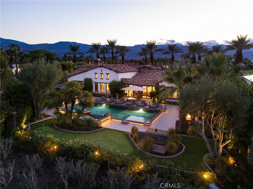 Welcome to 43360 Via Siena, a beautifully updated single-level estate located in the prestigious Estates section of Toscana Country Club in Indian Wells. Set on one of the largest lots in the community at over 21,700 square feet, this home offers exceptional privacy, luxury, and space in one of the desert’s most exclusive guard-gated communities, with 24/7 security and on-site staff.
Spanning 5,836 square feet of interior living space, the home features six bedrooms and seven bathrooms, including a detached guest casita with its own kitchenette and ensuite bath. From the moment you enter, you'll find elegant finishes, generous proportions, and an effortless flow between indoor and outdoor spaces. With convenience in mind, the home is also equipped with a control 4 home automation system.
The backyard is a private resort, complete with a pool and spa, outdoor kitchen, multiple fire pits, dining areas, and a personal putting green, all set against the backdrop of the pristine golf course. Inside, amenities include a dedicated media and theater room, a spacious dining area that opens to the outdoors, multiple interior fireplaces, and a garage that accommodates five vehicles as well as a gated motor court. One garage bay has been converted into a stylish lounge and golf simulator room.
Toscana Country Club is a private equity club community that offers an unmatched lifestyle in the Southern California desert. Members of the club enjoy two private Jack Nicklaus Signature Golf Courses, fine and casual dining options, a full service spa, a state-of-the-art Sports Club, and a full calendar of social and recreational activities. From golf tournaments and wine tastings to tennis mixers and wellness seminars, Toscana is known not just for its world-class amenities but for the vibrant and connected community it fosters.
43360 Via Siena is a rare opportunity to own one of the most expansive and well-appointed properties in Toscana’s most coveted enclave.