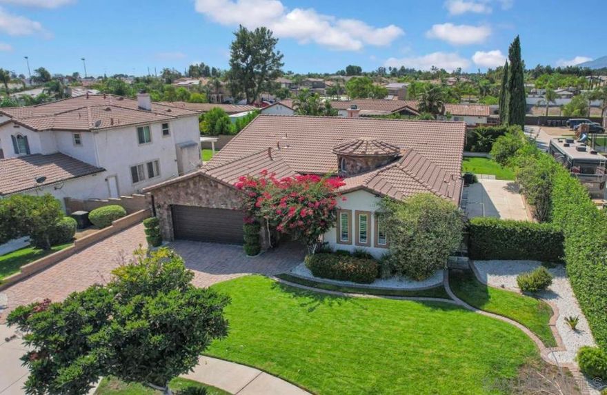 Welcome to this impeccably upgraded 5BD/4BA executive home located in a peaceful cul de sac in Rancho Cucamonga. Step inside to find luxurious 8-inch plank hardwood floors, soaring 12-foot ceilings with crown molding, and tasteful wainscoting throughout. The heart of the home is a designer kitchen featuring granite countertops, a generous island, stainless steel appliances including a double oven, and abundant cabinet space. It flows seamlessly into a spacious family room highlighted by a marble mosaic fireplace and a built-in media niche. The primary suite is a true retreat, offering a stunning spa-inspired bathroom with mosaic marble flooring, a freestanding clawfoot tub, an oversized marble shower with frameless glass, and a custom vanity. The nearly 12,000 square foot lot offers RV access with 220V power, and a large covered patio perfect for gatherings or quiet evenings outdoors. The backyard offers endless potential for a pool, play area, or garden. Built in 2003 with high-quality stone and stucco construction and a tile roof, this single-level home also features a two-car attached garage, gated RV parking and a security system. Short distance to freeway, shops, schools and more, this is a rare opportunity to own a truly turnkey luxury home in one of Rancho Cucamonga's most desirable neighborhoods.