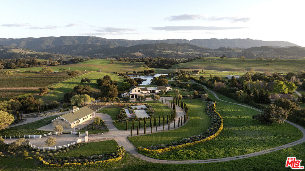 Welcome to the Duck Club Where Dreams Don't Just Come True, They BeginTucked into the heart of the Santa Ynez Valley, just beyond the whispering vineyards of Brave & Maiden and Sunstonelies a place so magical, it feels like a dream you never want to wake up from.Introducing The Duck Club, a private 26-acre sanctuary where luxury meets imagination. This custom-designed modern estate, spanning over 6,500 square feet, is more than a home, it's an experience. Here, every detail has been crafted for a life well-lived, well-loved, and well-celebrated.Imagine waking up to sun-drenched mornings with panoramic vineyard views and ending the day at your very own two-acre private lake, toes in the sand, drink in hand. Swim, fish, kayak, or simply float, this is your everyday escape.Step inside and be embraced by soaring walls of glass that dissolve the boundary between indoors and out. Entertain effortlessly in a showstopping chef's kitchen, complete with a special dining space just for your furry family members. Host unforgettable weekends in the rockstar-style party barn. Or retreat to the fully furnished Airstream and hot tub for a moonlit soak and a little extra guest space.With 5 bedrooms, 6.5 baths, sports courts, solar power, and a private water source, The Duck Club is completely turnkey, designed for those who crave both adventure and peace in equal measure.This is where memories are made. Where kids catch their first fish. Where friends gather under the stars. Where time slows down just enough for you to breathe it all in.Welcome home.All that's left is to pack your bags, because we already have the keys waiting.