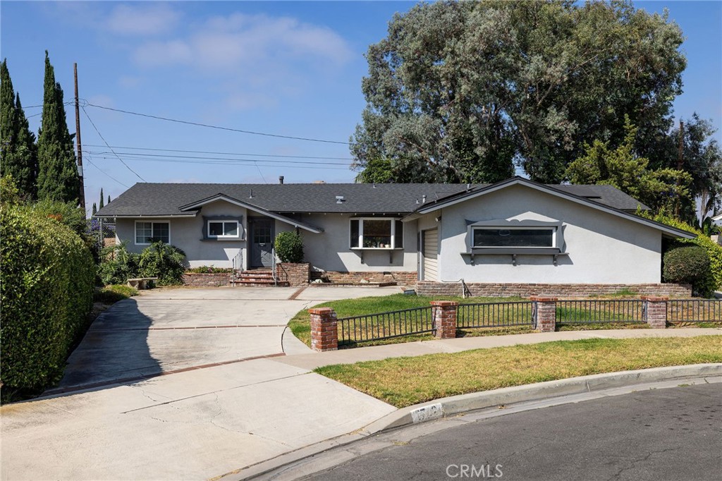 Bring your imagination and vision to this fixer in one of Tustin's most coveted neighborhoods. This single level, mid century classic boasts 4 bedrooms, a private dining room, living room with fireplace, a separate family room, inside laundry room, direct access to the two car garage and an extra long driveway plus a private yard. The primary bedroom is expansive and has dual closets. The owners have made significant improvements: paid-for solar, a new roof was installed in 2015, the exterior was re-stuccoed, they upgraded the electrical panel, replaced the water heater and remodeled one bathroom. No HOA and paid-for solar saves you money. Highly regarded Tustin Unified School District. With an unbeatable location near Old Town Tustin, shopping, restaurants and coffee shops, this home is a rare find. Don't miss your chance to make it your own.