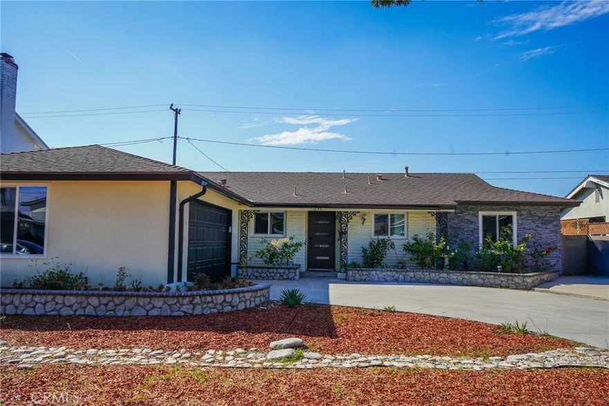 Welcome to 1133 S Chantilly St in Anaheim — a beautifully remodeled 4-bedroom, 2-bath single-story home available for $4,700/month. This elegant residence features an open-concept layout with polished tile flooring, a designer kitchen with quartz countertops, stainless steel appliances, and a wine fridge. The bathrooms are fully upgraded with quartz-style walls, matte black fixtures, and LED mirrors, adding a touch of luxury. Enjoy a bright living area that opens to a private backyard, perfect for relaxing or entertaining, plus a two-car garage and central A/C. Nestled in a quiet, well-kept neighborhood near the 57 Freeway, this home offers quick access to shopping, dining, and entertainment at Anaheim Town Square, Angel Stadium, and the Anaheim Packing District. Outdoor enthusiasts will love nearby Anaheim Coves Trail and Hillview Park, making this the perfect blend of modern comfort and peaceful suburban living.